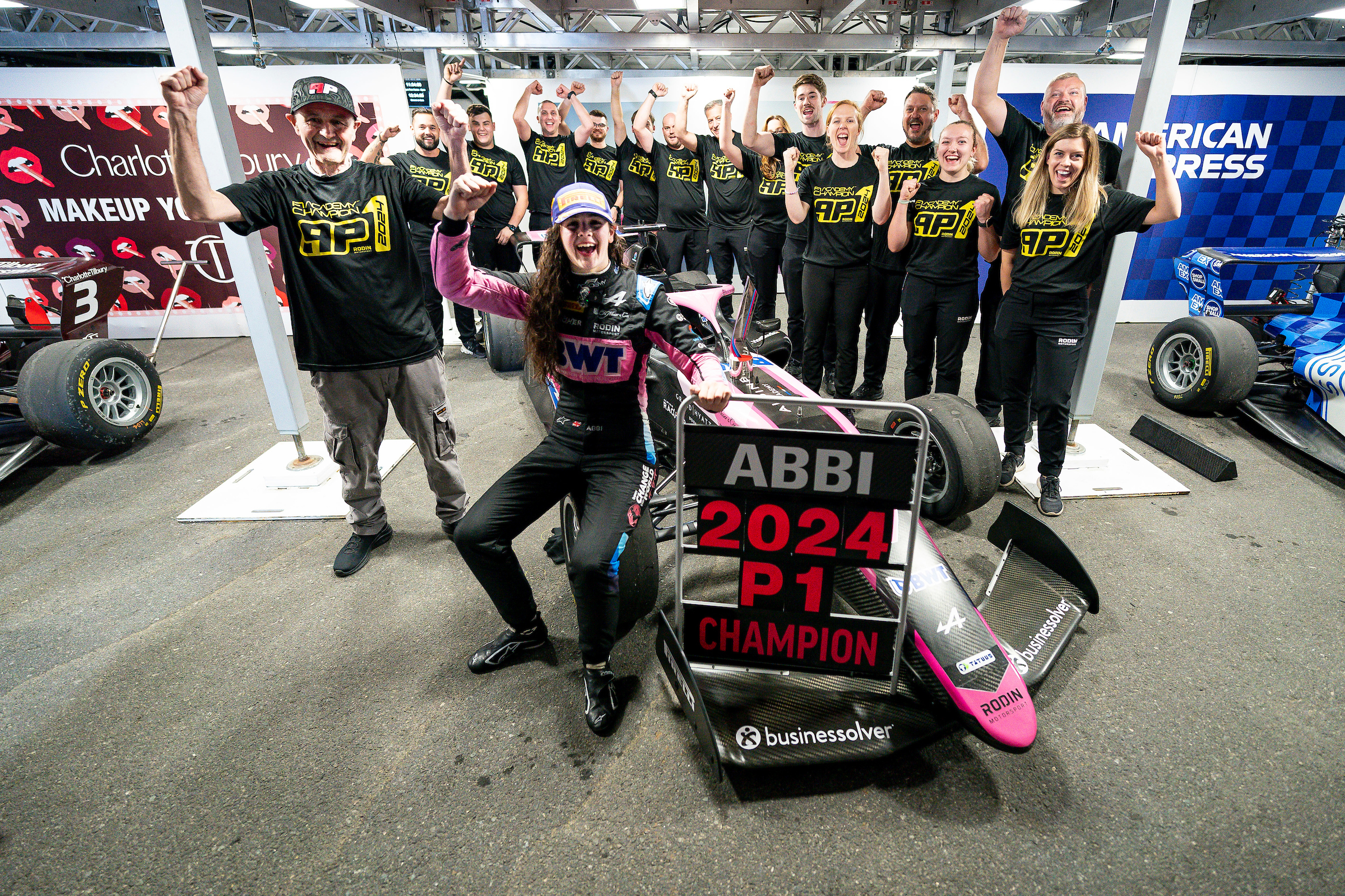 Abbi Pulling celebrating on her car