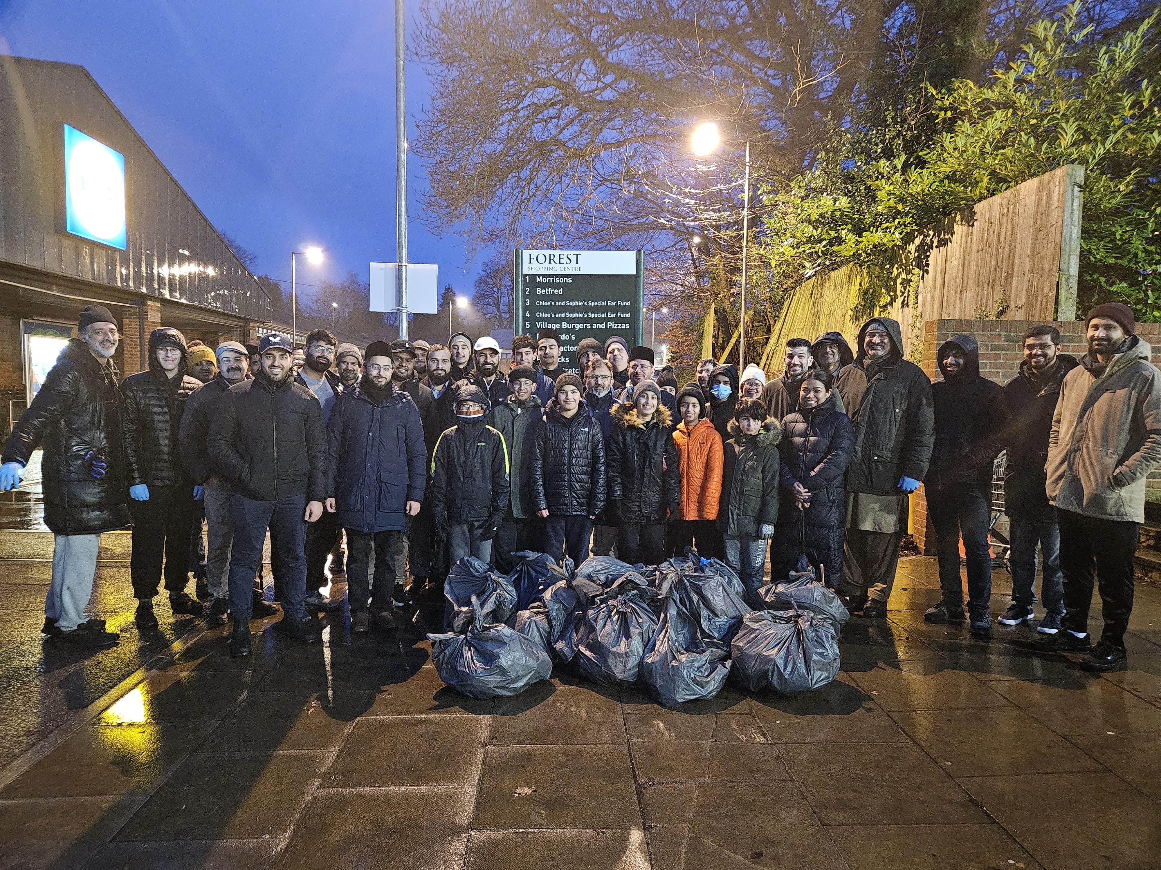 A group of people with rubbish bags