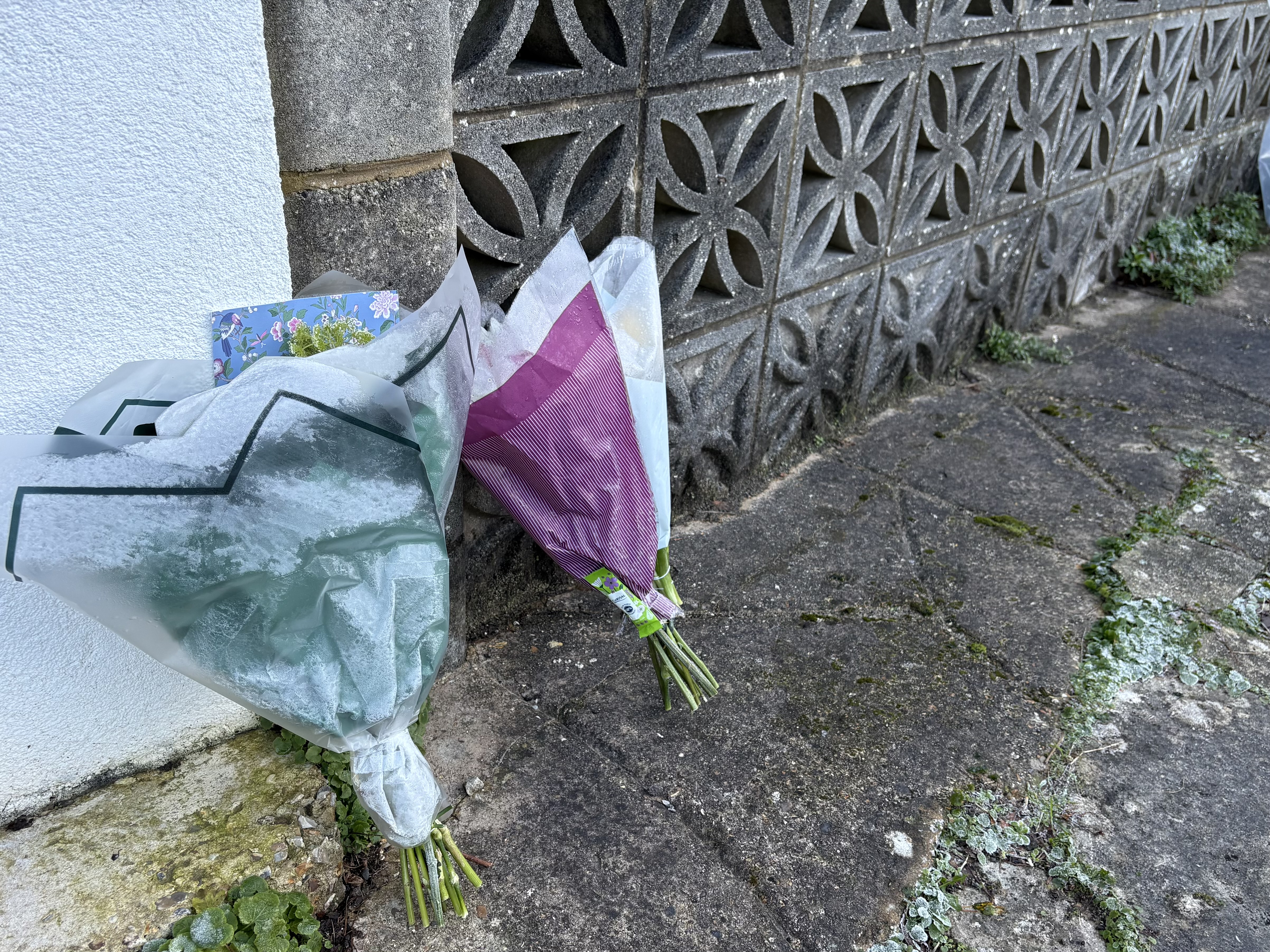 Flowers left on the driveway of a house in Poole