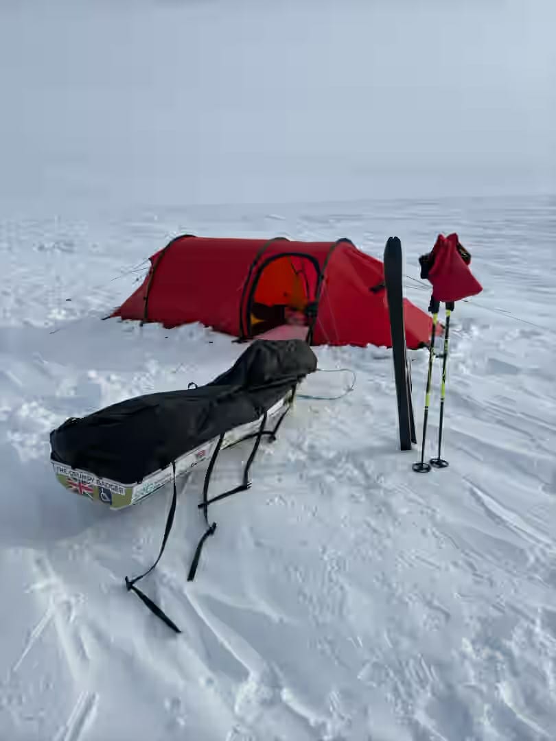 A tent in the middle of snow