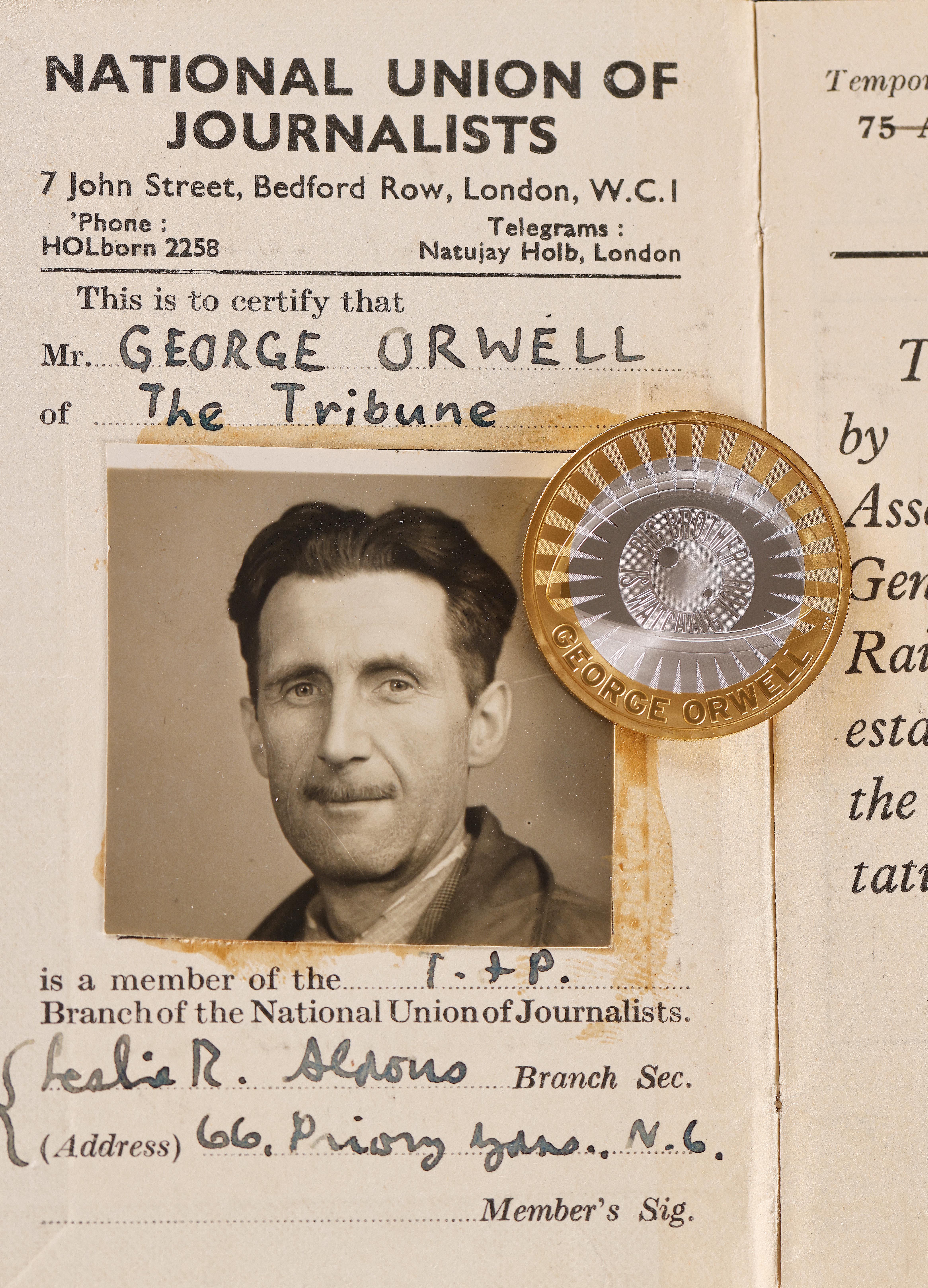 The new George Orwell £2 coin on top of his NUJ ID card