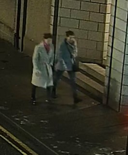 Image from CCTV of two women walking along a road