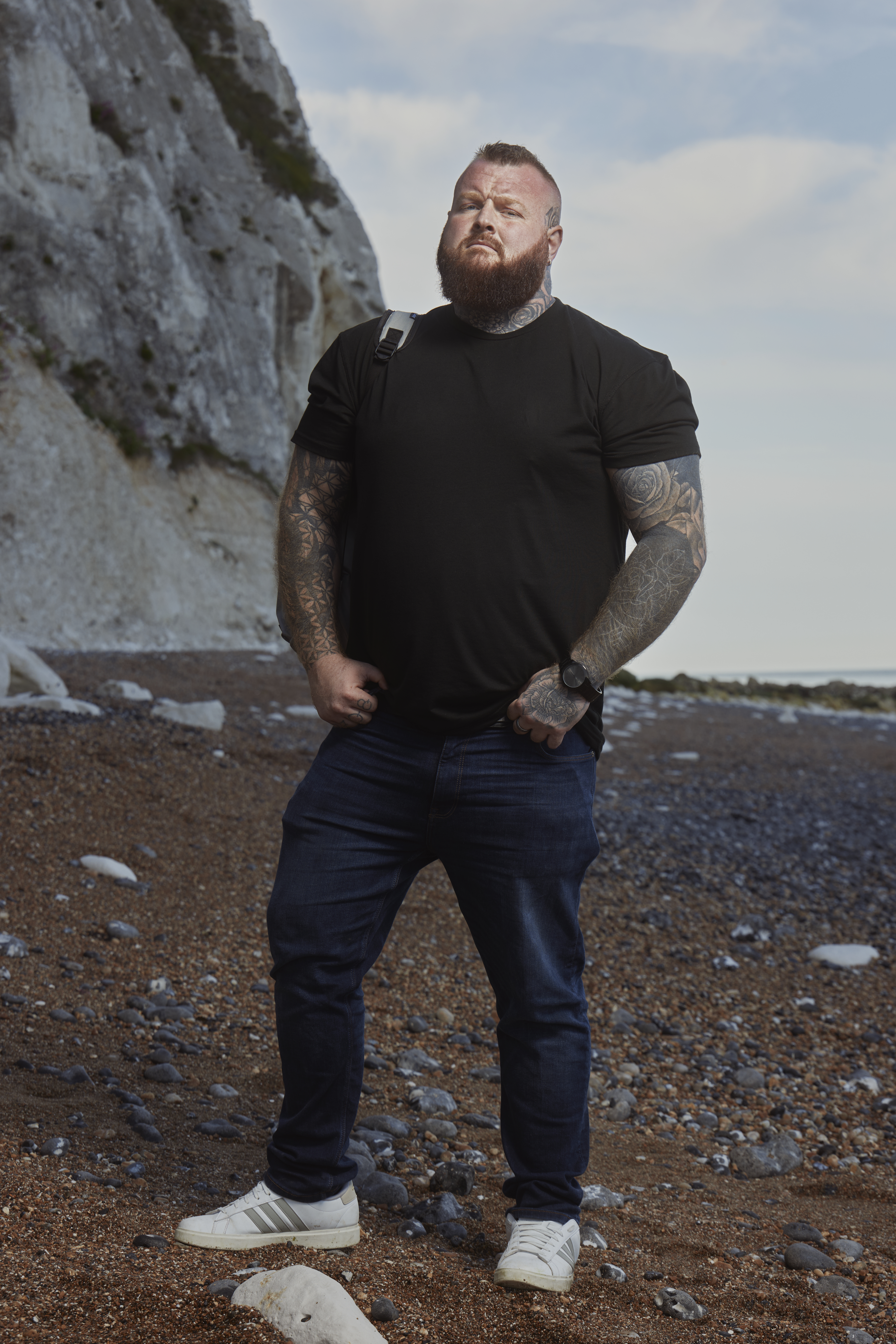 Nathan whob owns a haulage business in Barnsley, Yorkshire and is taking part in Channel 4 Show Go Back to Where You Came From standing on a beach