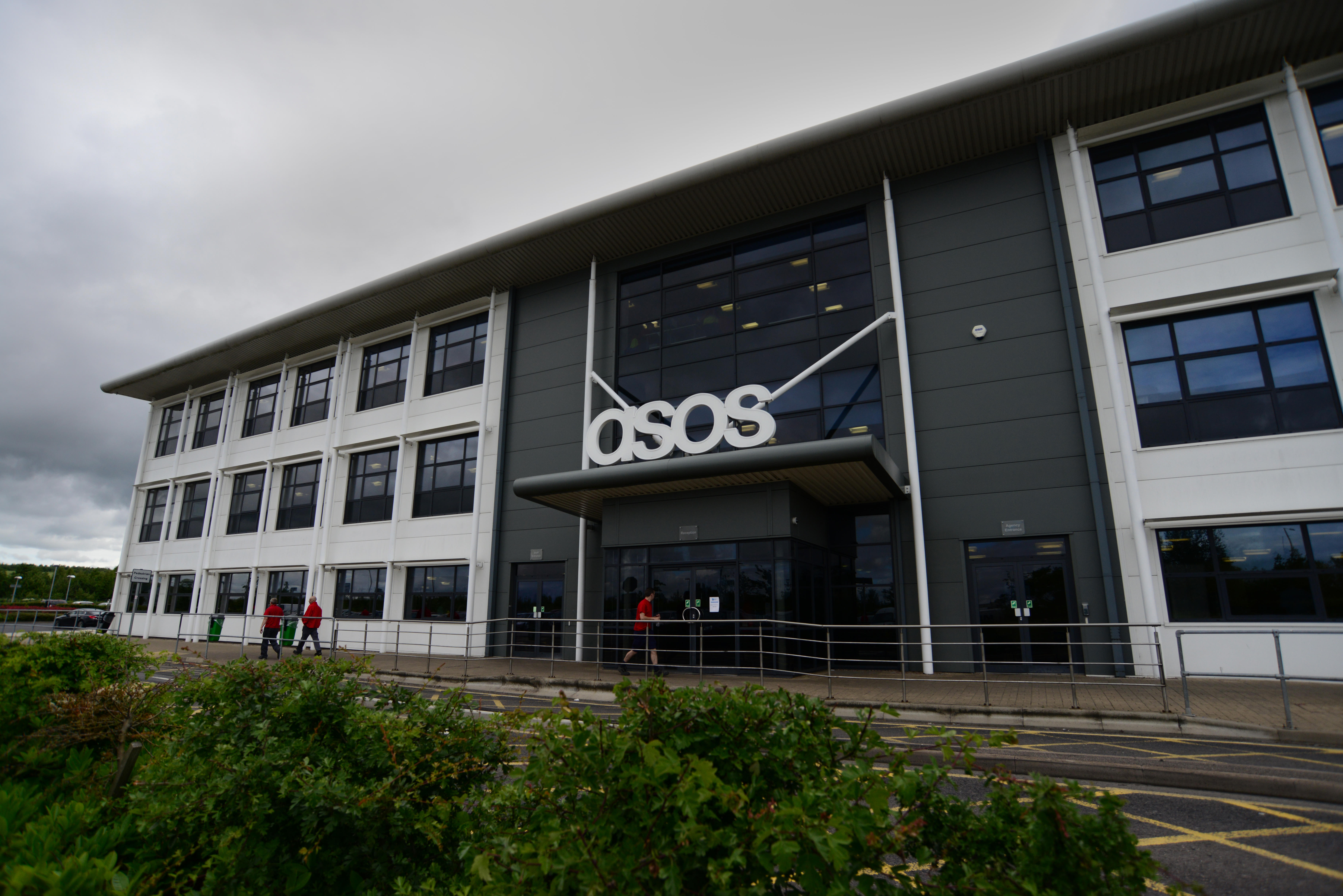 Exterior view of a building with a sign on the front reading 'asos' in white letters