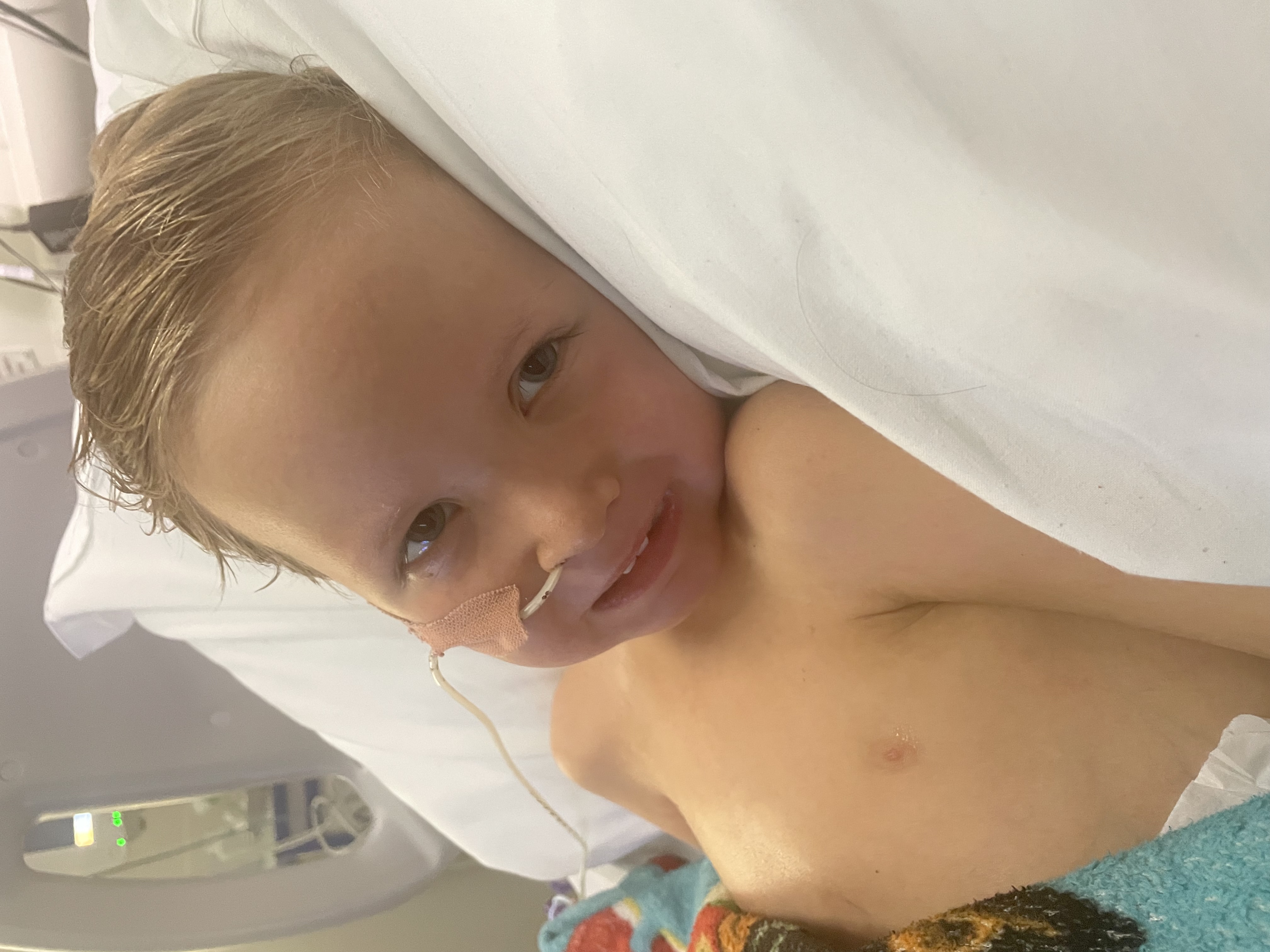 Isaac Perry, six, in a hospital bed