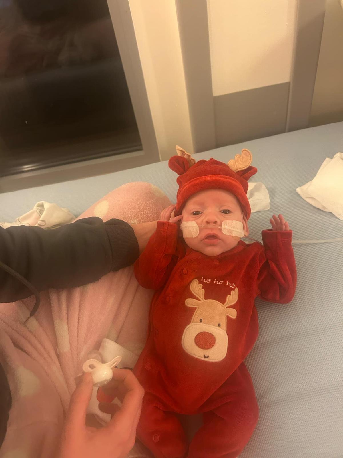 Hope McArthur wearing a Rudolph onesie