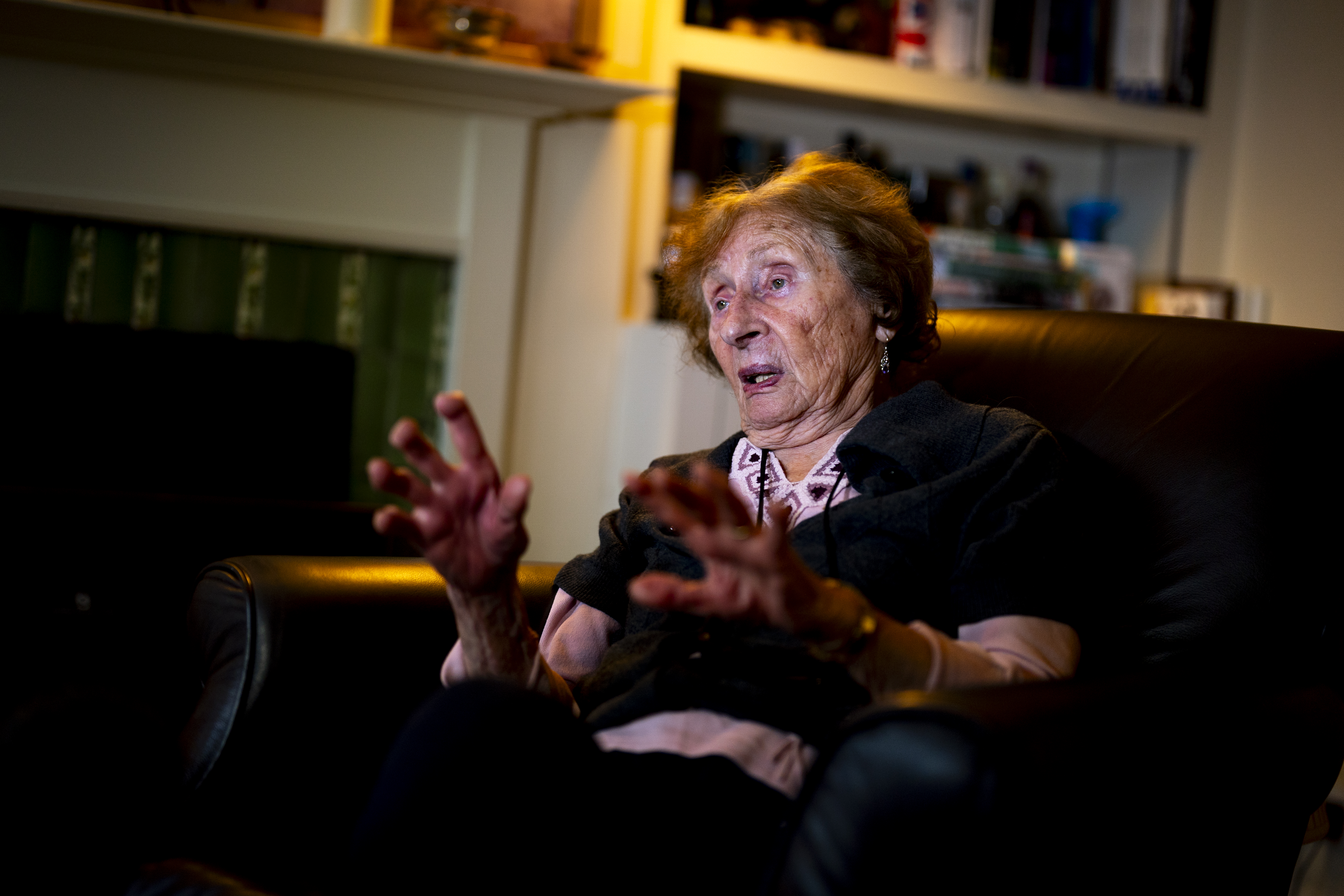 Susan Pollack gestures in her chair