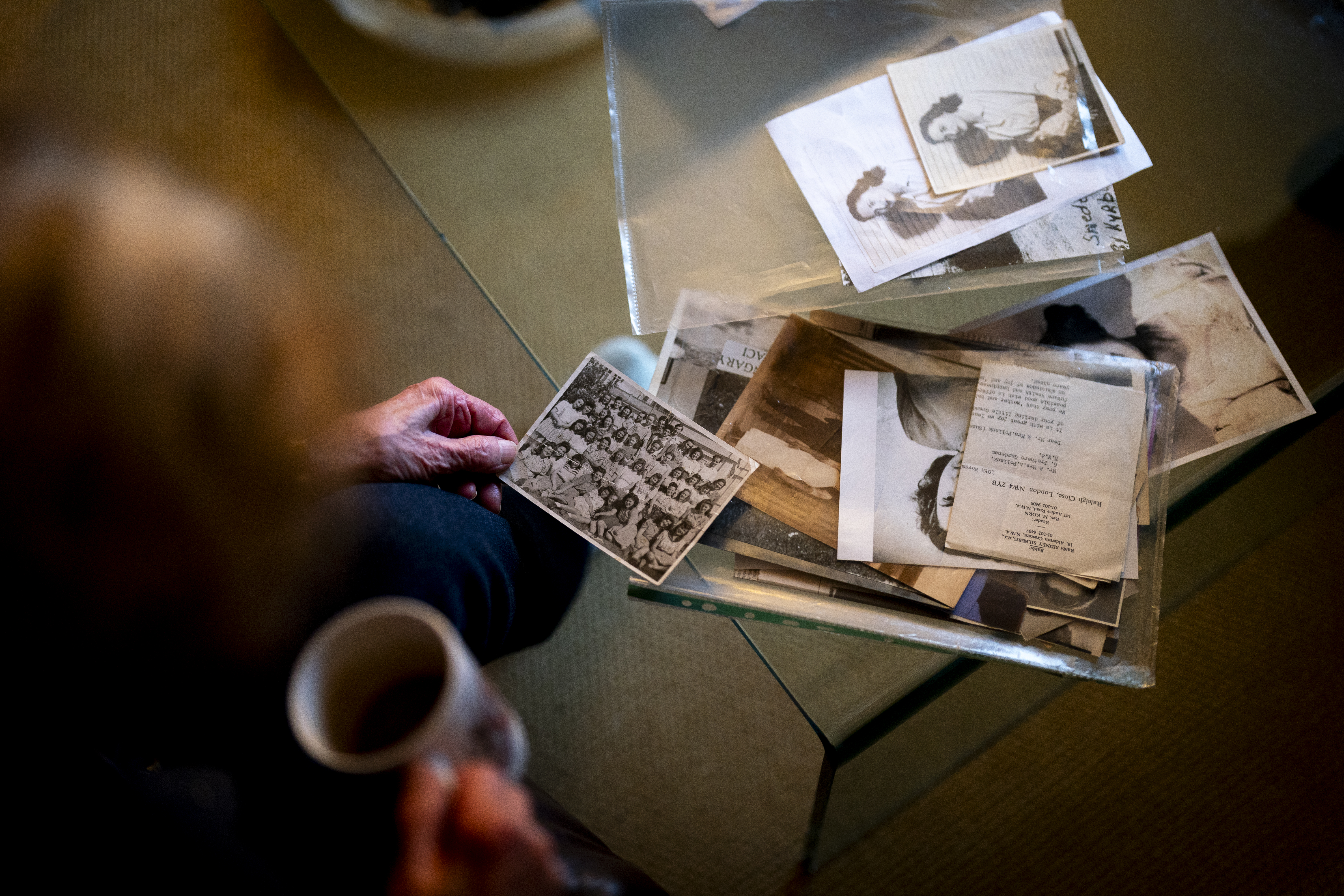 Holocaust survivor Susan Pollack with old photographs and documents from her youth 