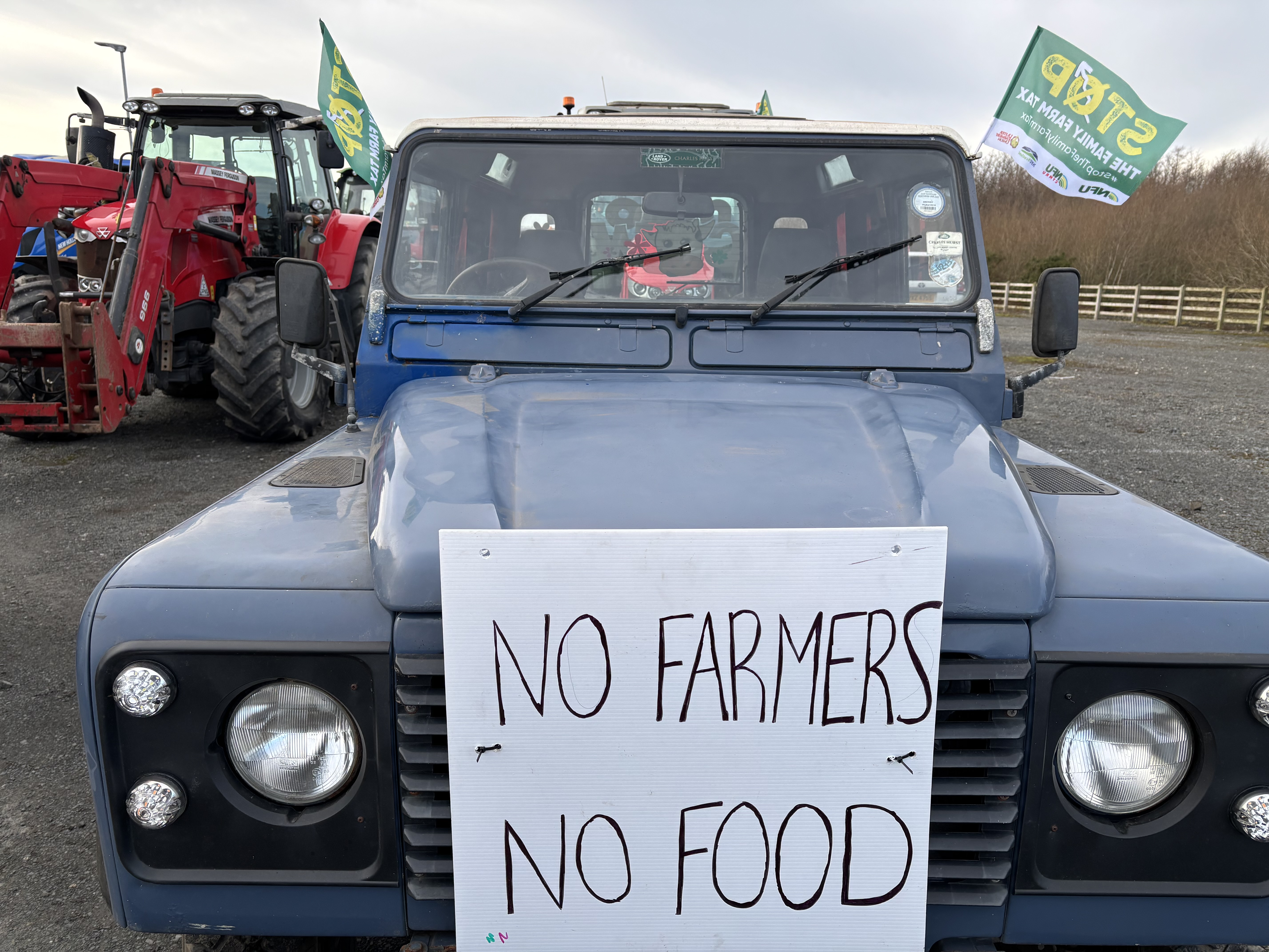 A vehicle with a sign on it saying No Farmers No Food