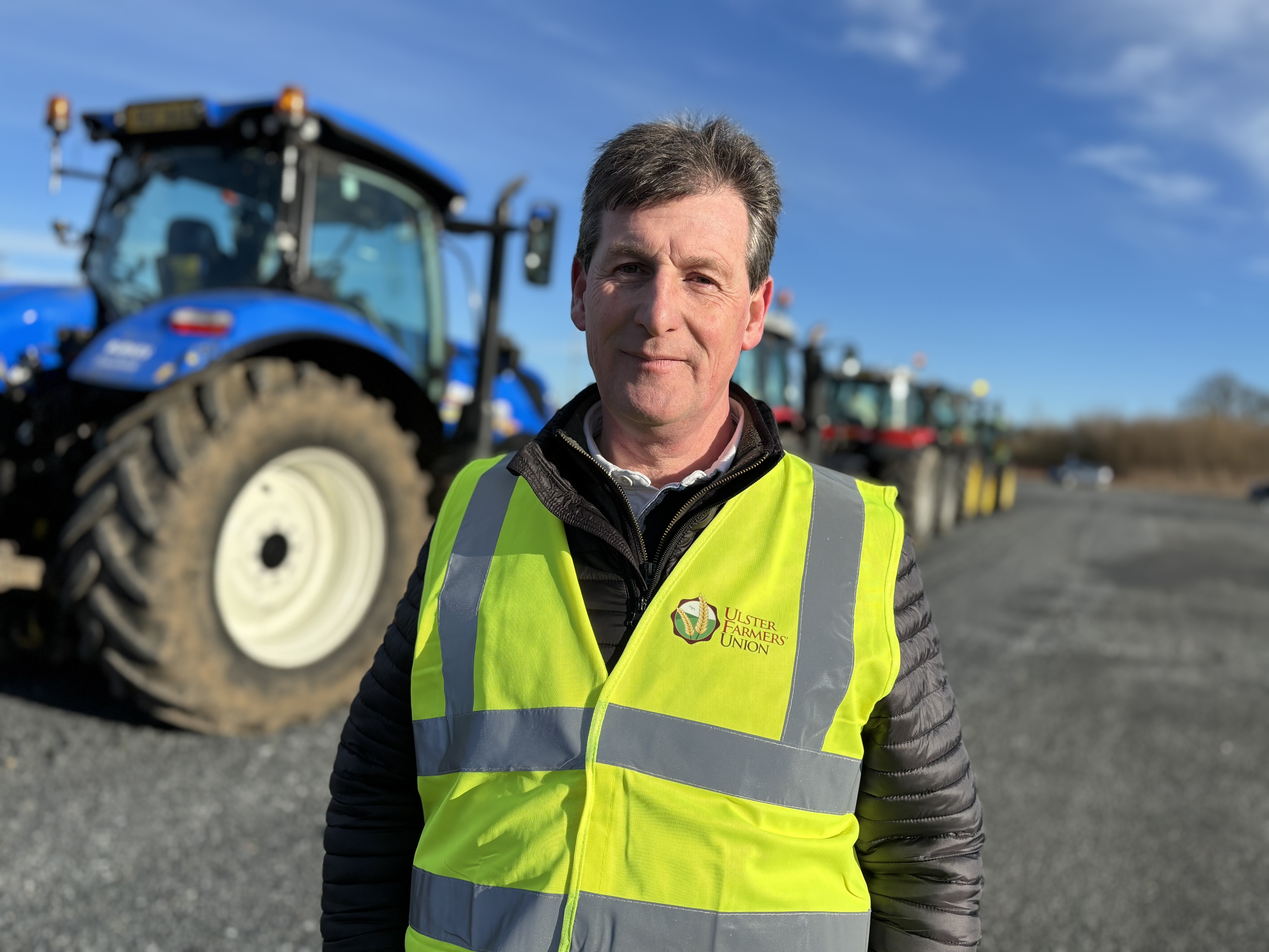 Wesley Aston, chief executive of the Ulster Farmers Union, stands by a tractor