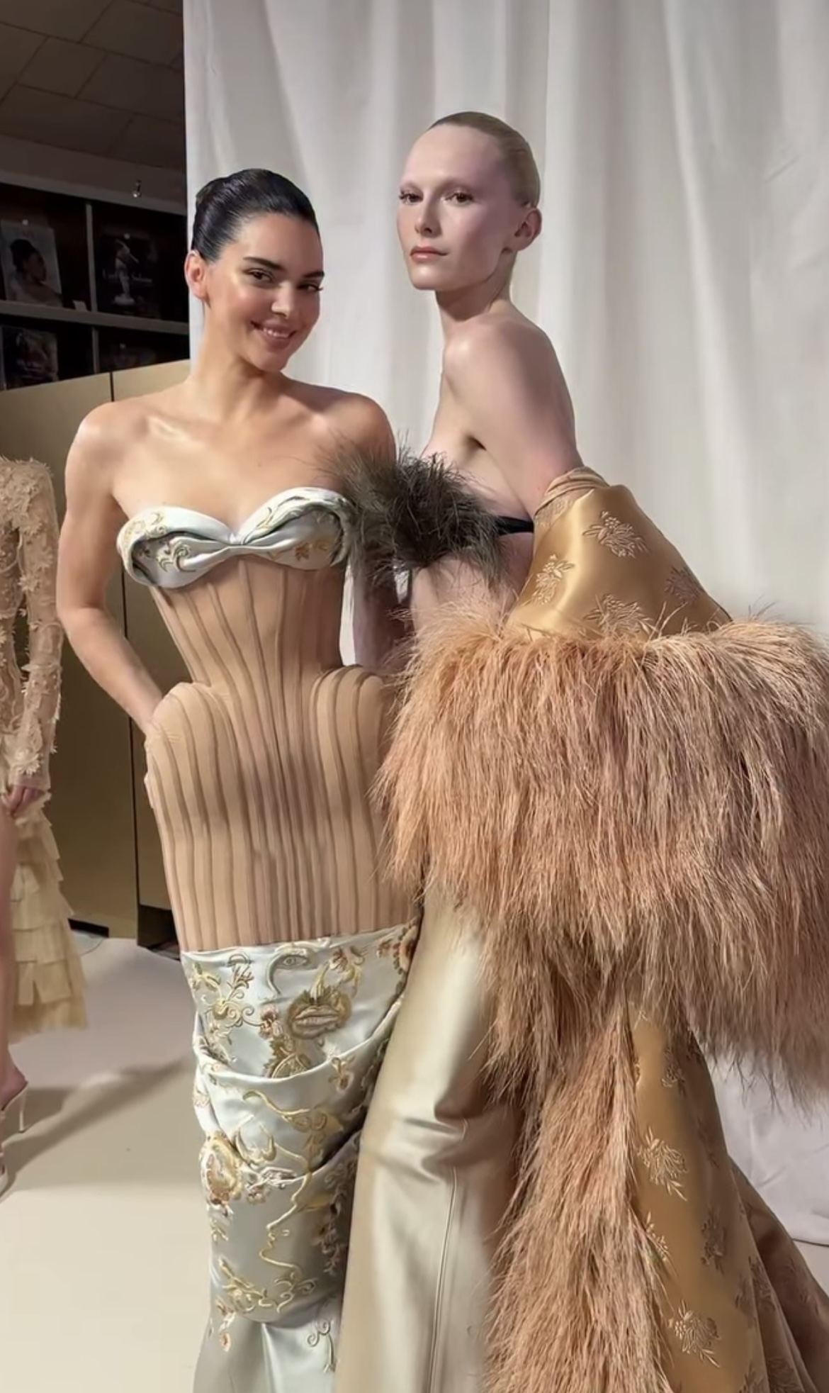 Kendall Jenner poses with model behind the scenes of Schiaparelli haute couture show