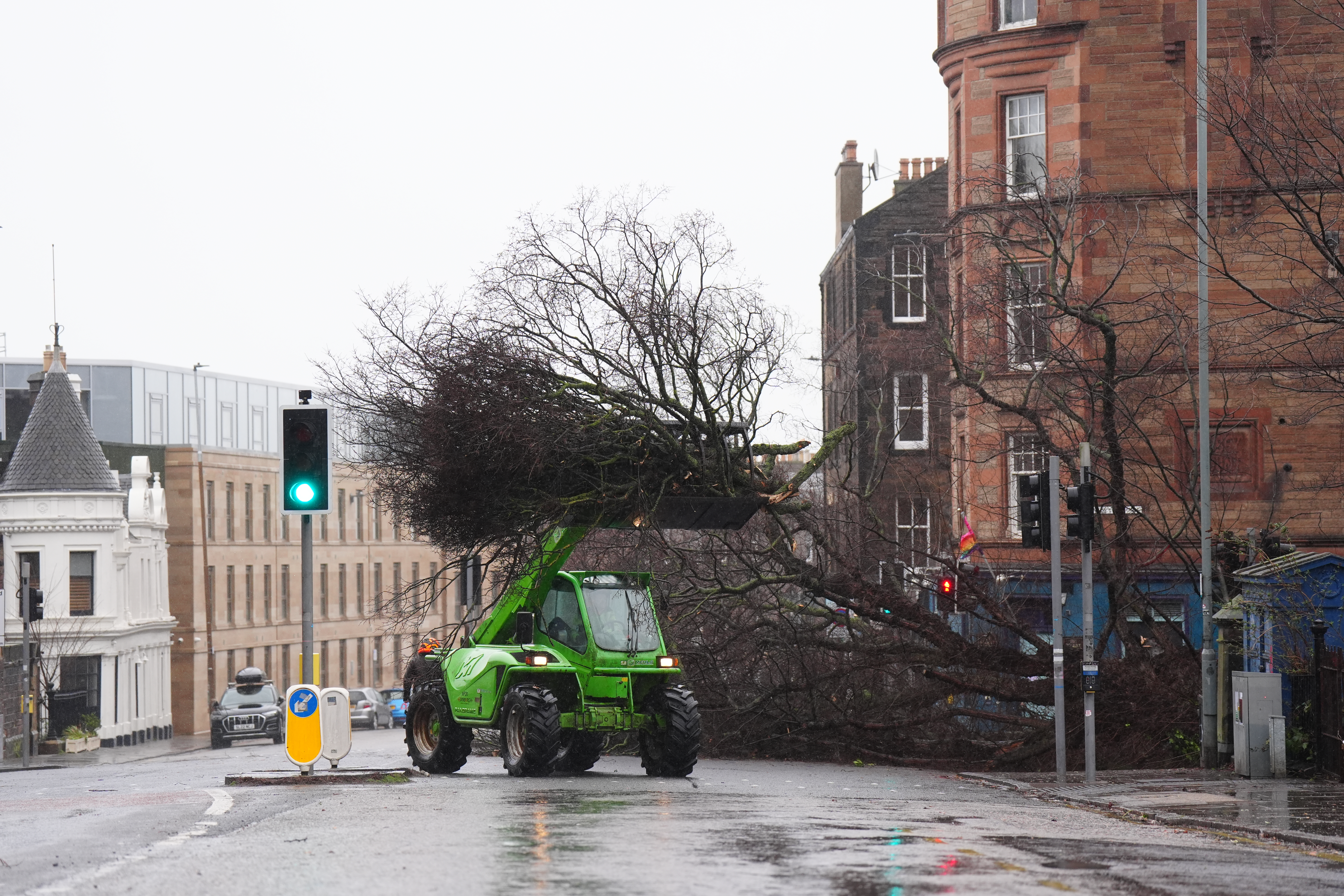 Storm damage is cleared from roads