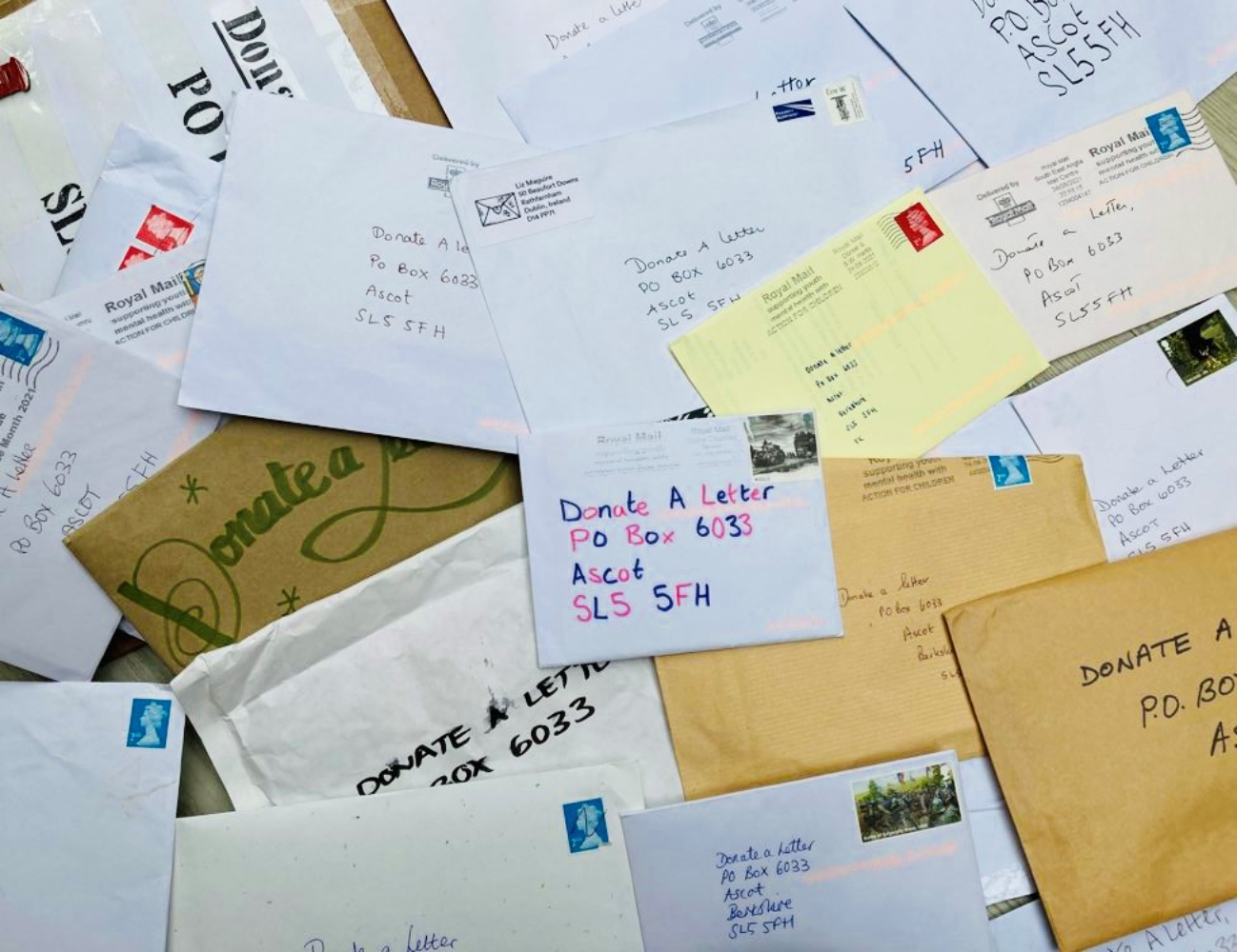 Top-down shot of a table scattered with unopened letters