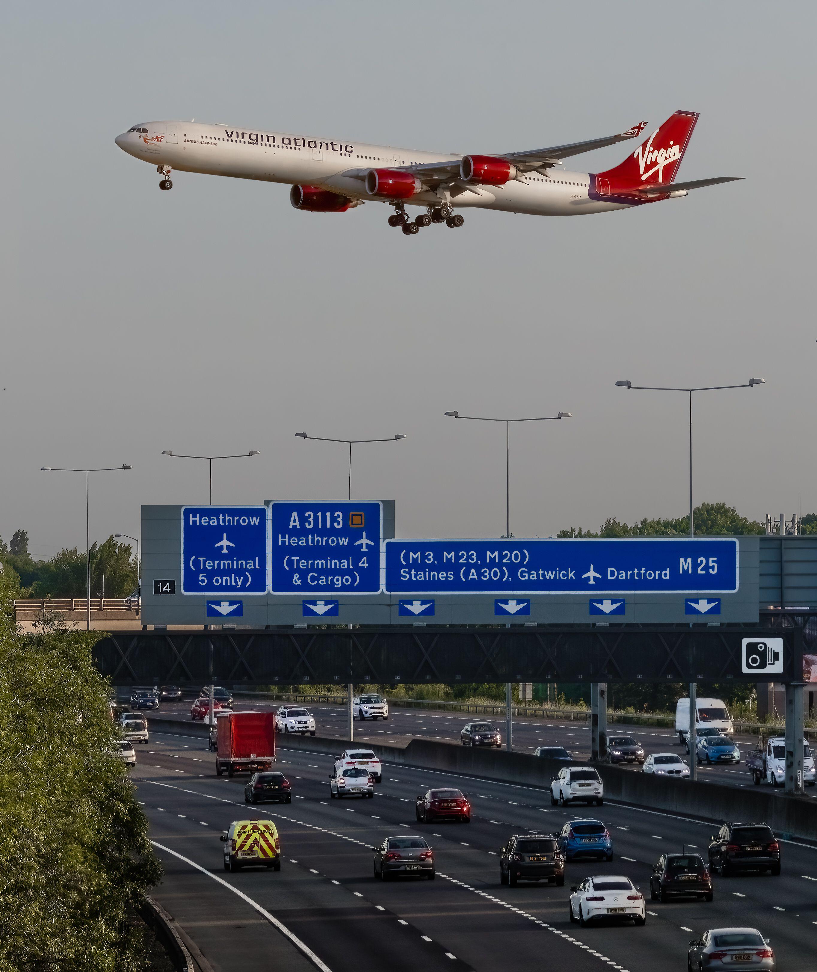 A Virgin Atlantic plane flies above the M25