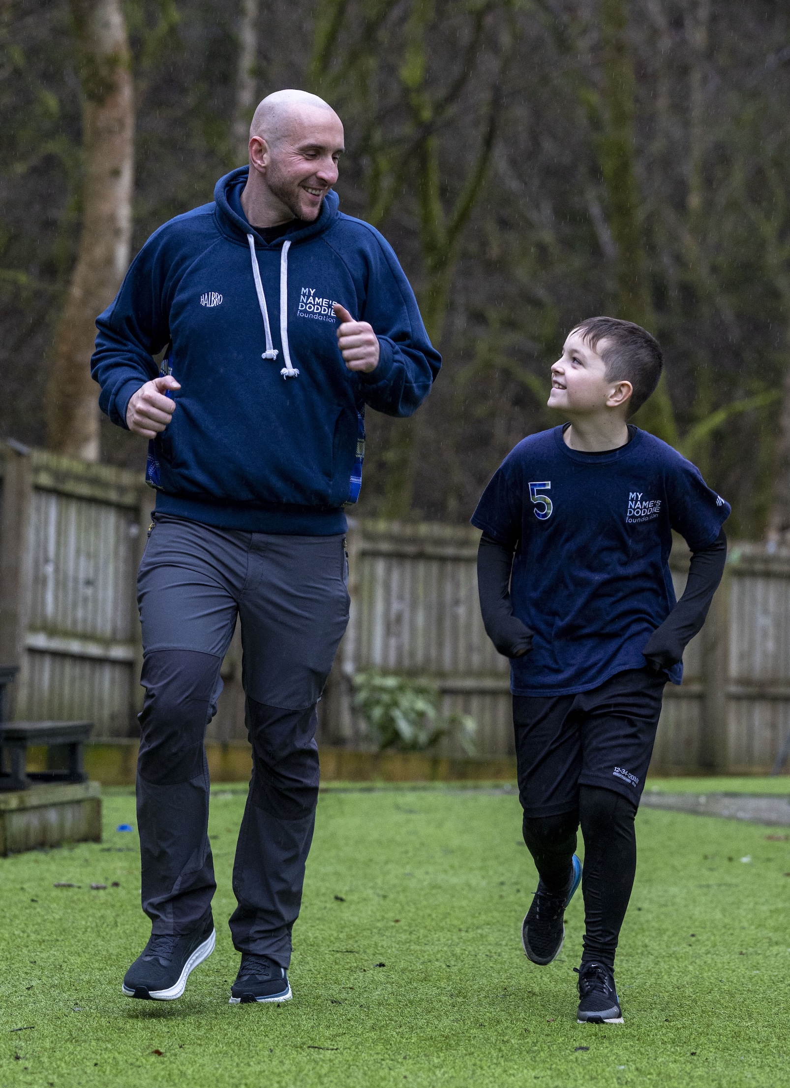 Harvey running alongside his dad outside