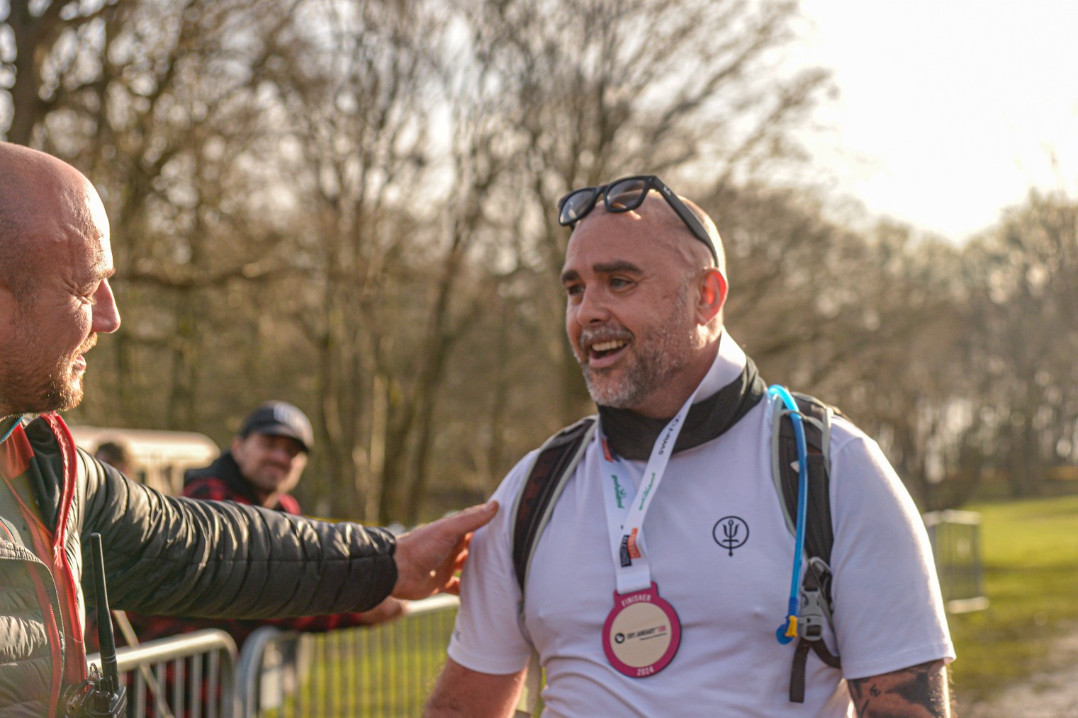 Chris Linnitt wearing a medal after finishing the Dry January 10k in 2024