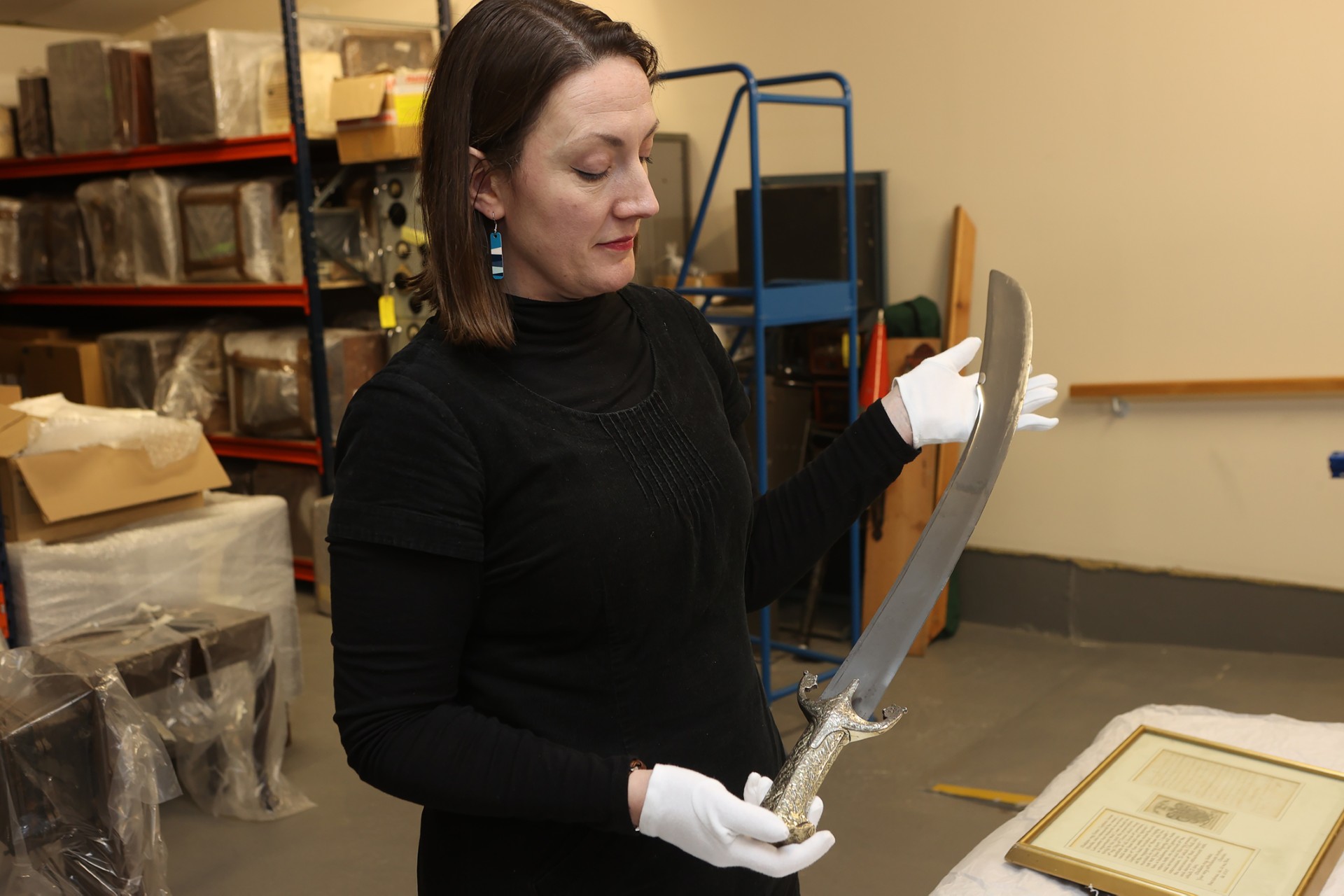 Woman holds a scimitar