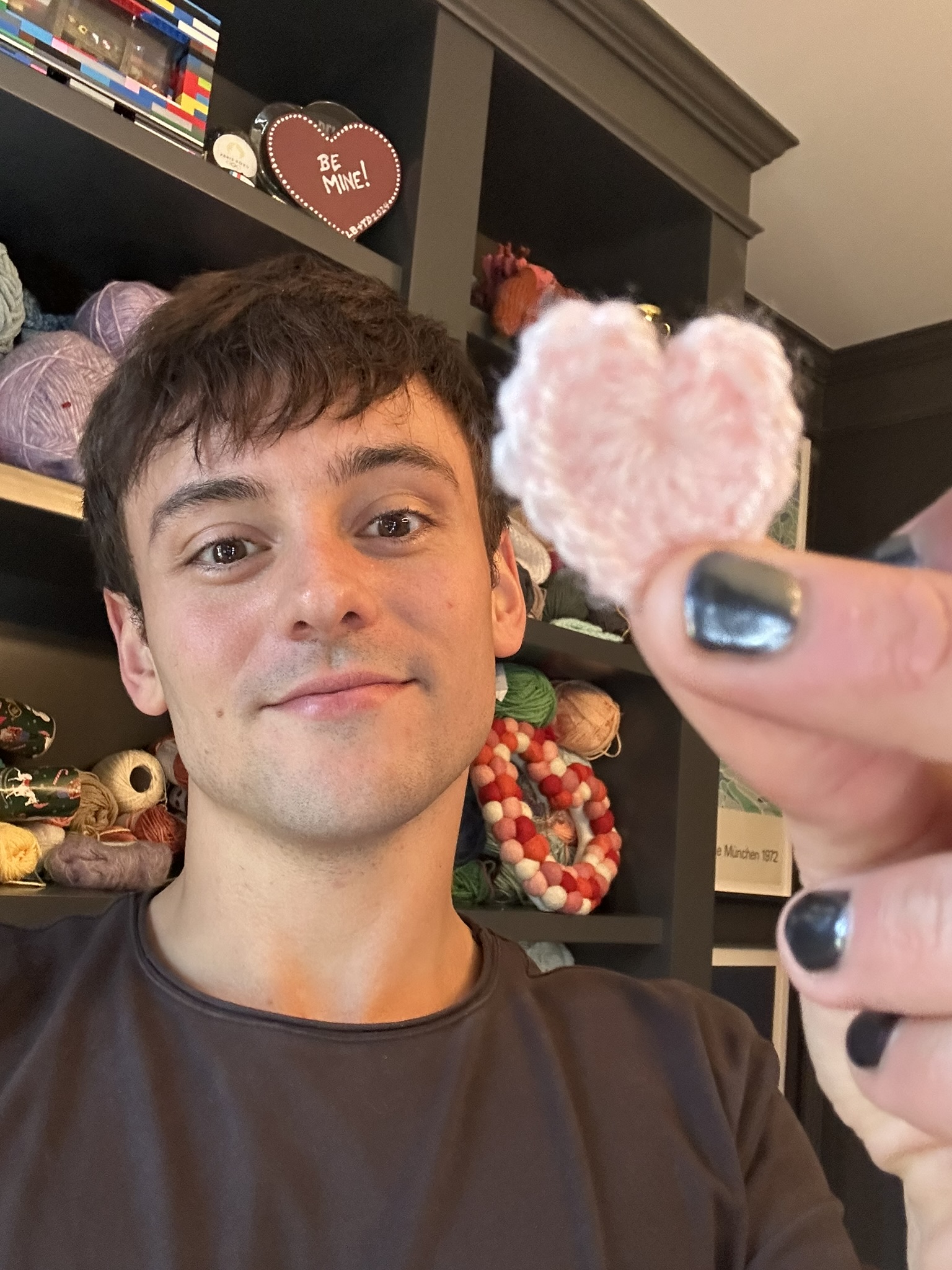 A man holding a pink heart