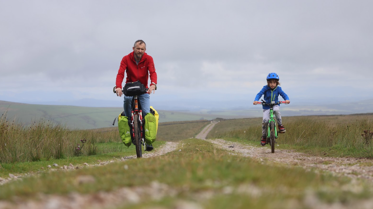 Volodymyr Muliar pictured cycling with his son, Marko