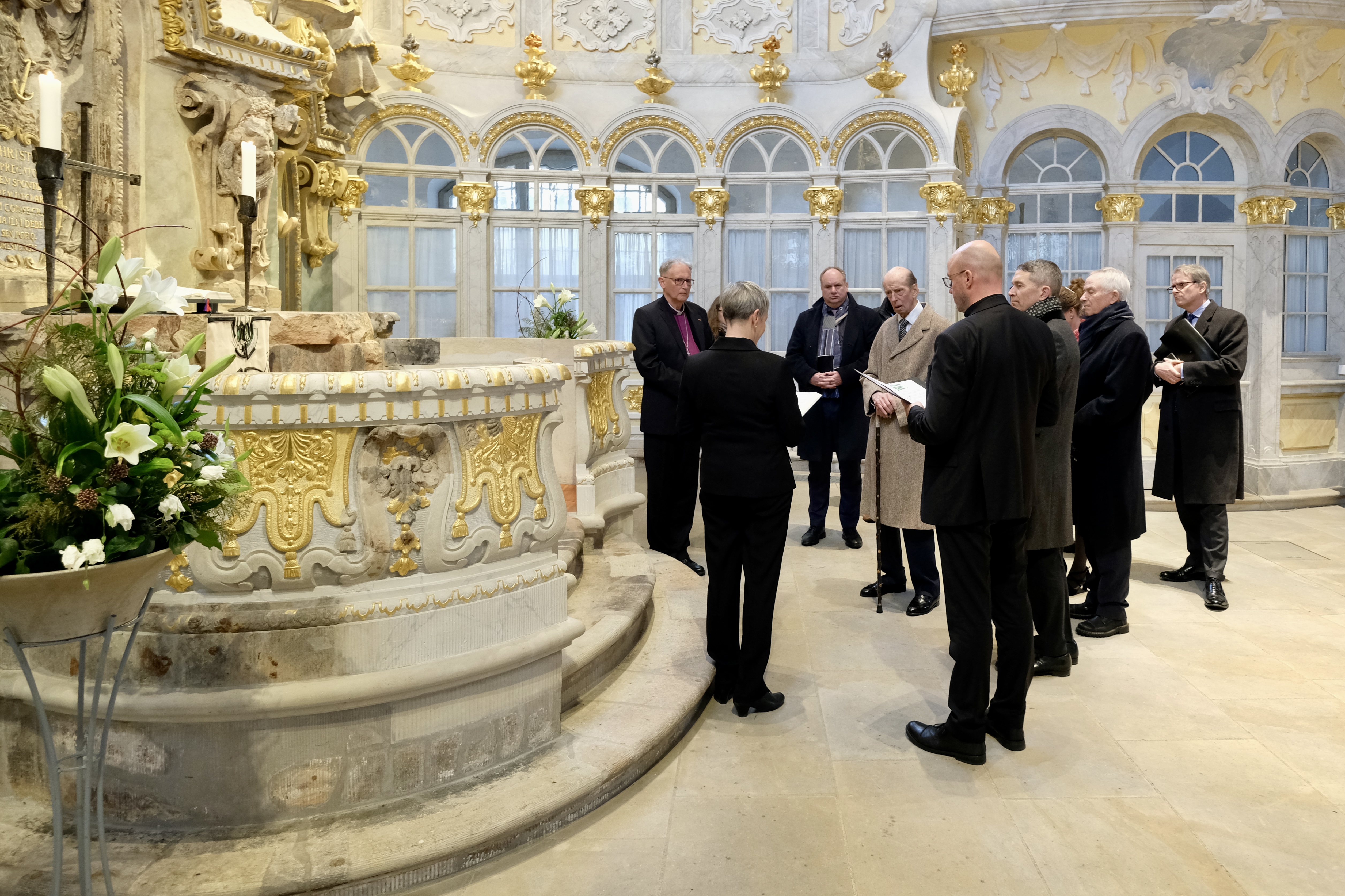 The duke inside the Frauenkirche as clergy perform a moment of reflection