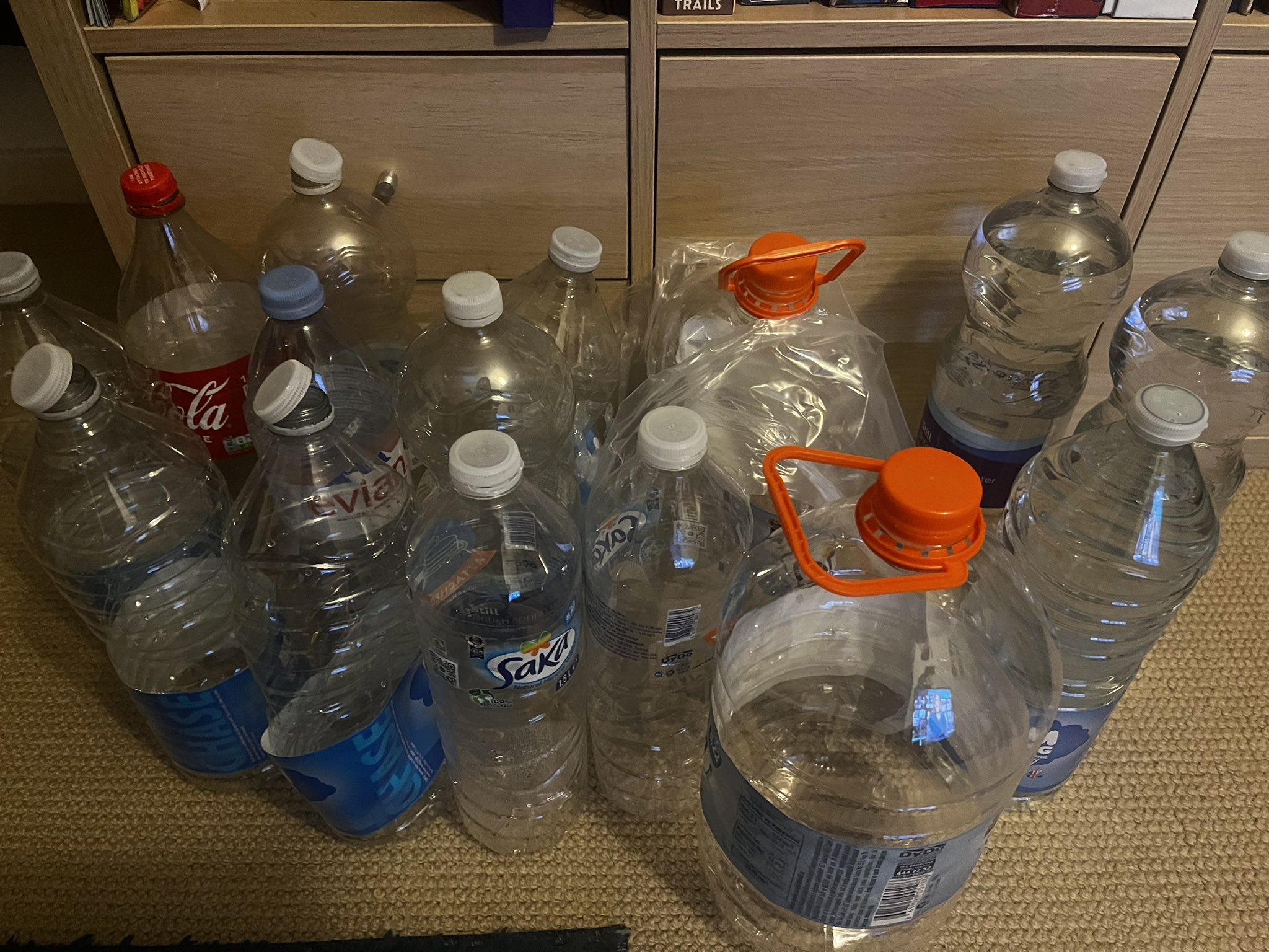 A pile of empty bottles of water