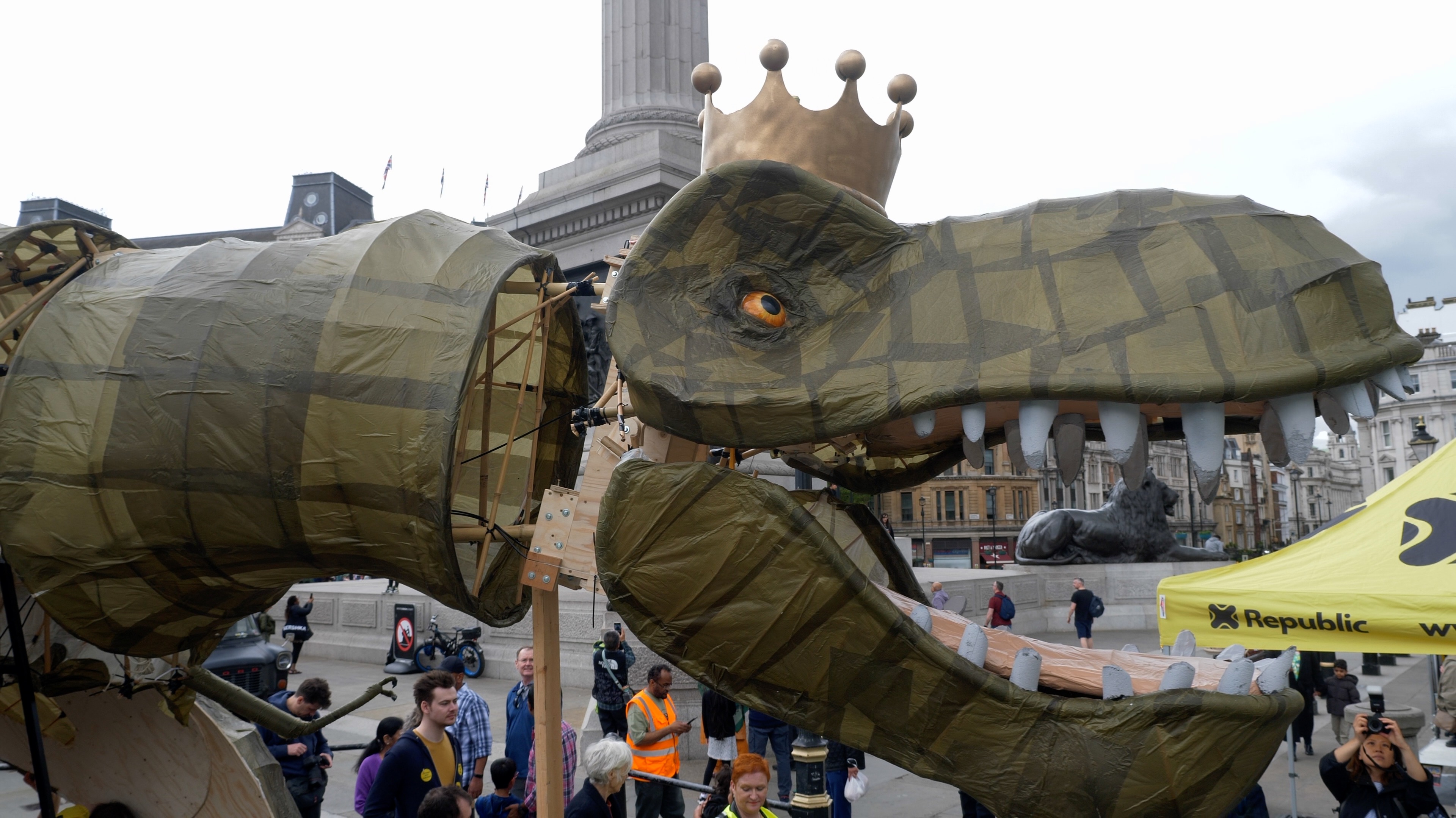 A close-up of the head of Republic's new dinosaur mascot which wears a golden crown