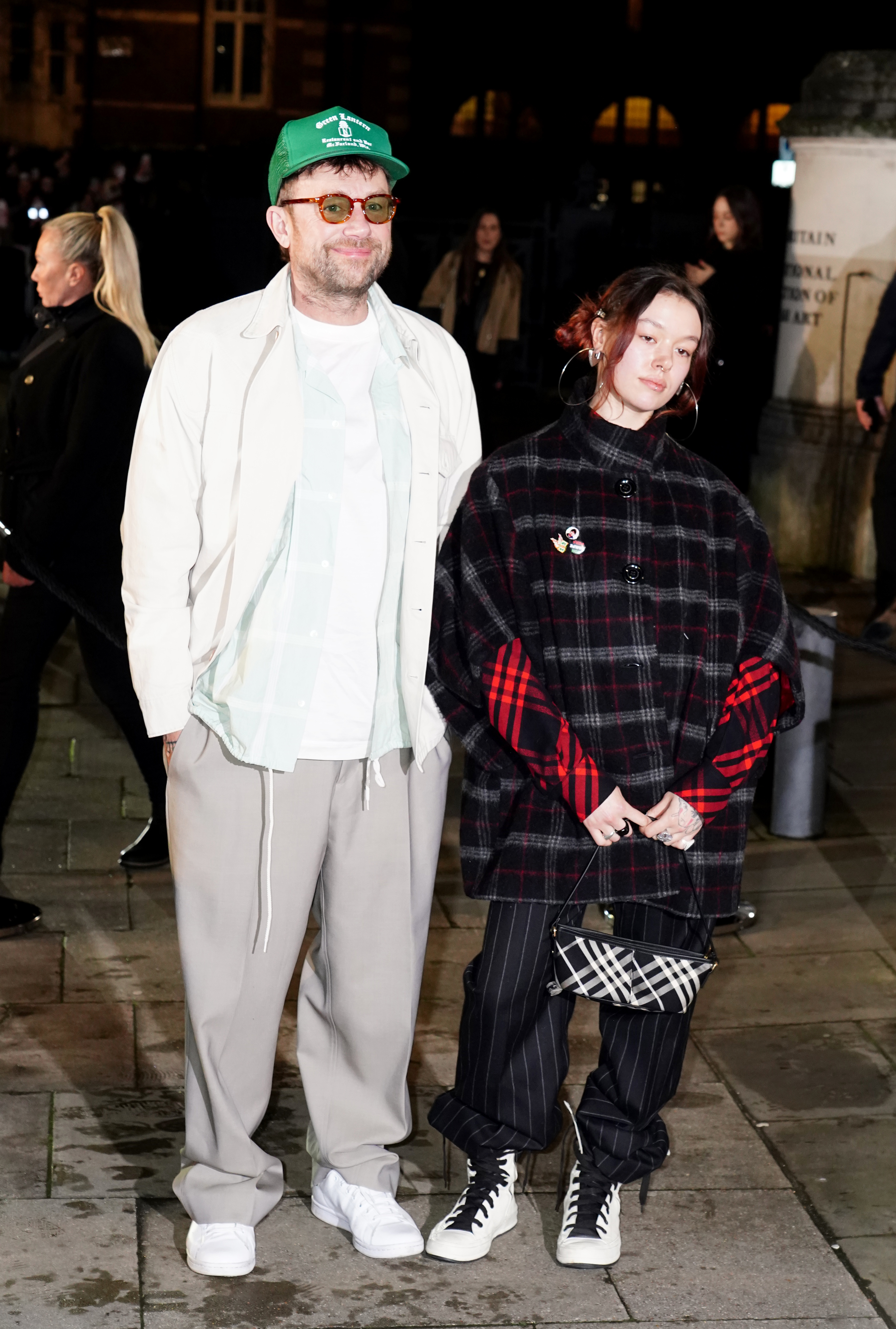 Damon Albarn (left) and his daughter Missy Albarn arriving at the Burberry show at Tate Britain, London, during London Fashion Week.