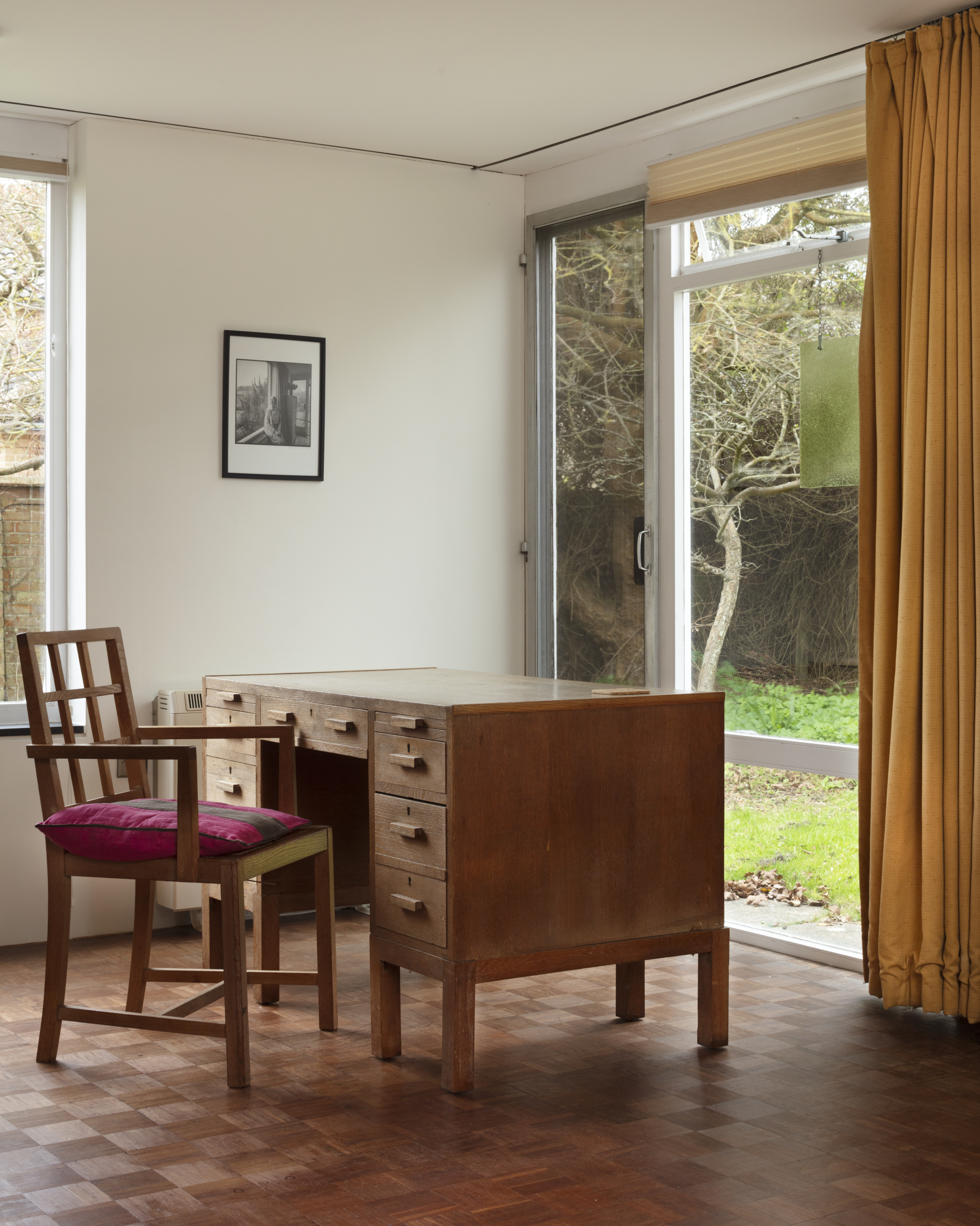 The living room at nine Church Walk in Aldeburgh, Suffolk and Imogen Holst's desk