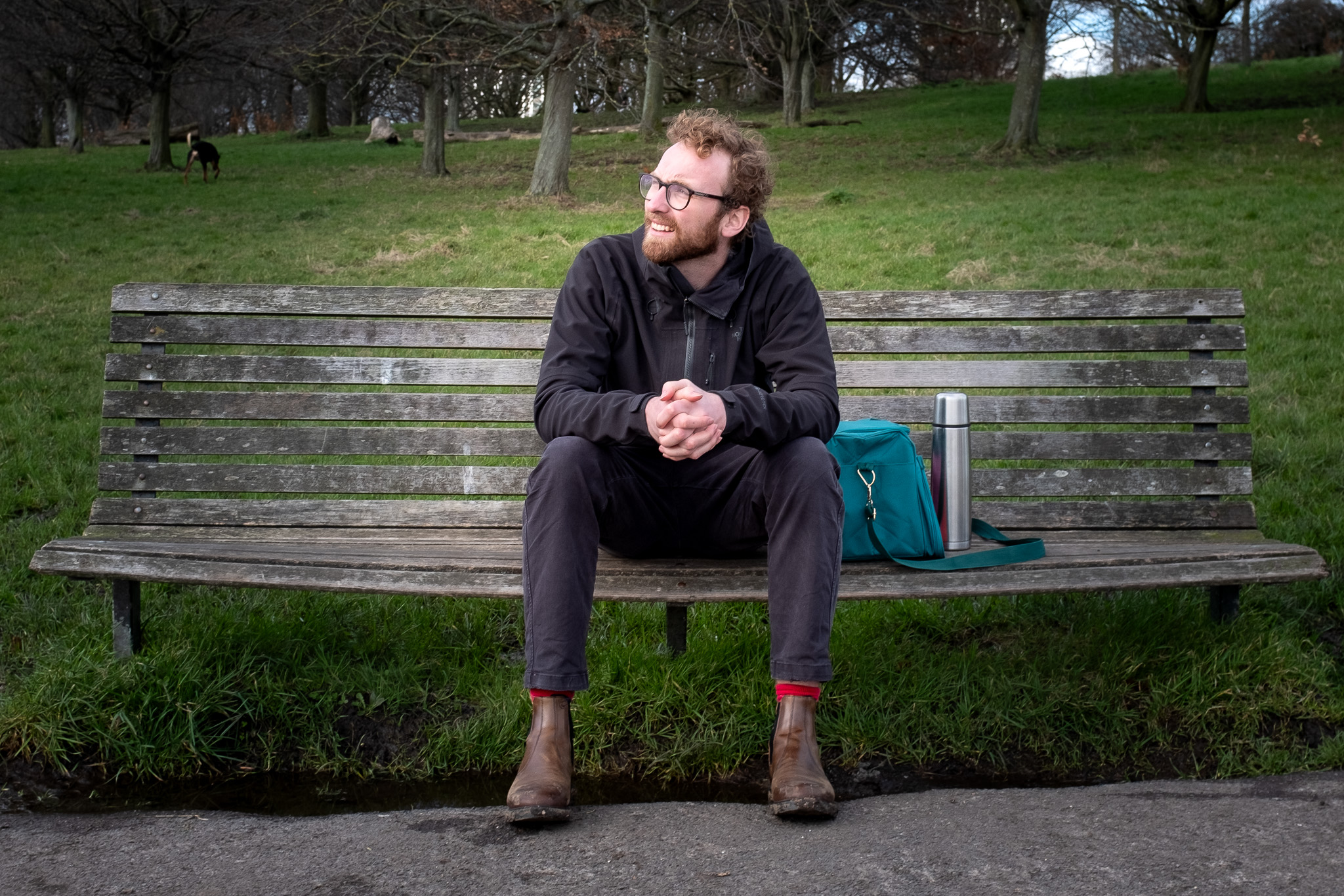 Filmmaker Will Shears sittng on a bench