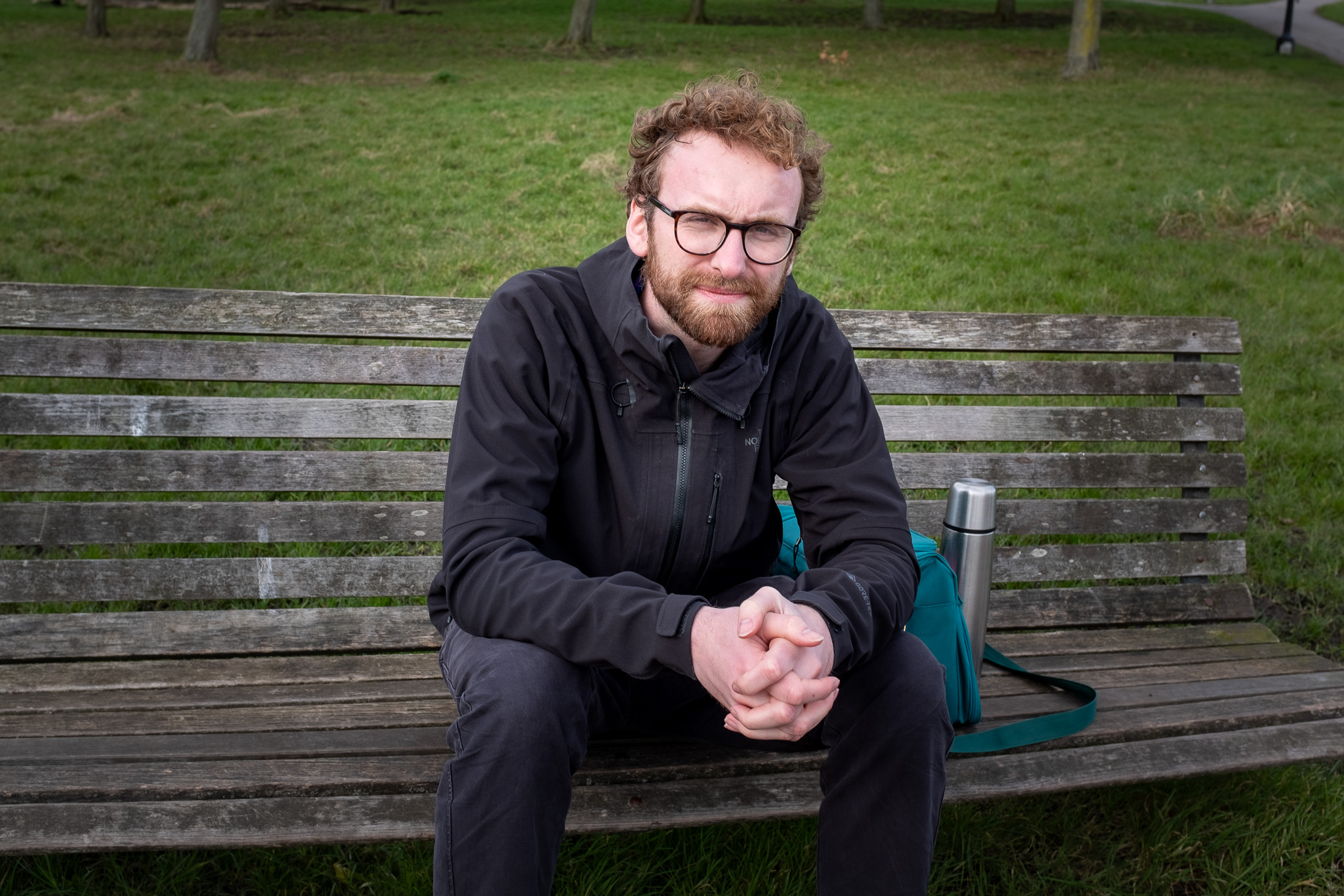 Filmmaker Will Shears sitting on a bench