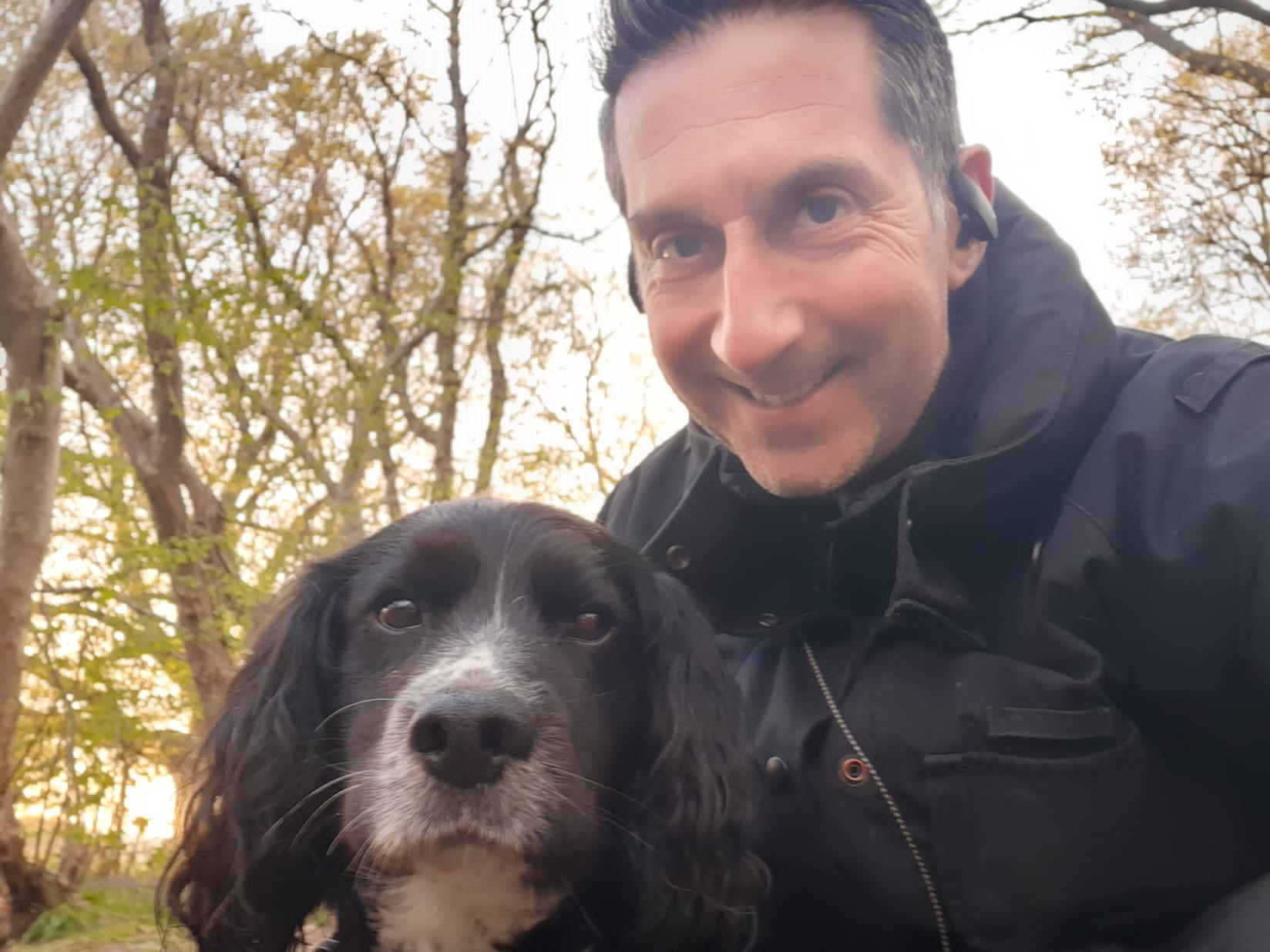 Sherlock's handler, Group Commander Paul Osborne with cocker spaniel Sherlock