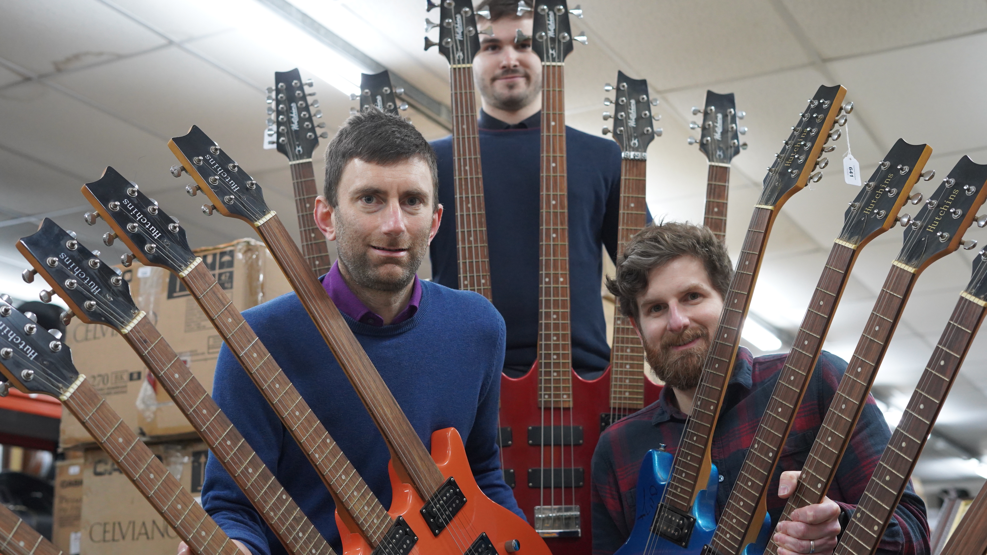 Joby Hobbs (l) and Luke Hobbs (r) with the five neck guitars (Gardiner Houlgate/PA)