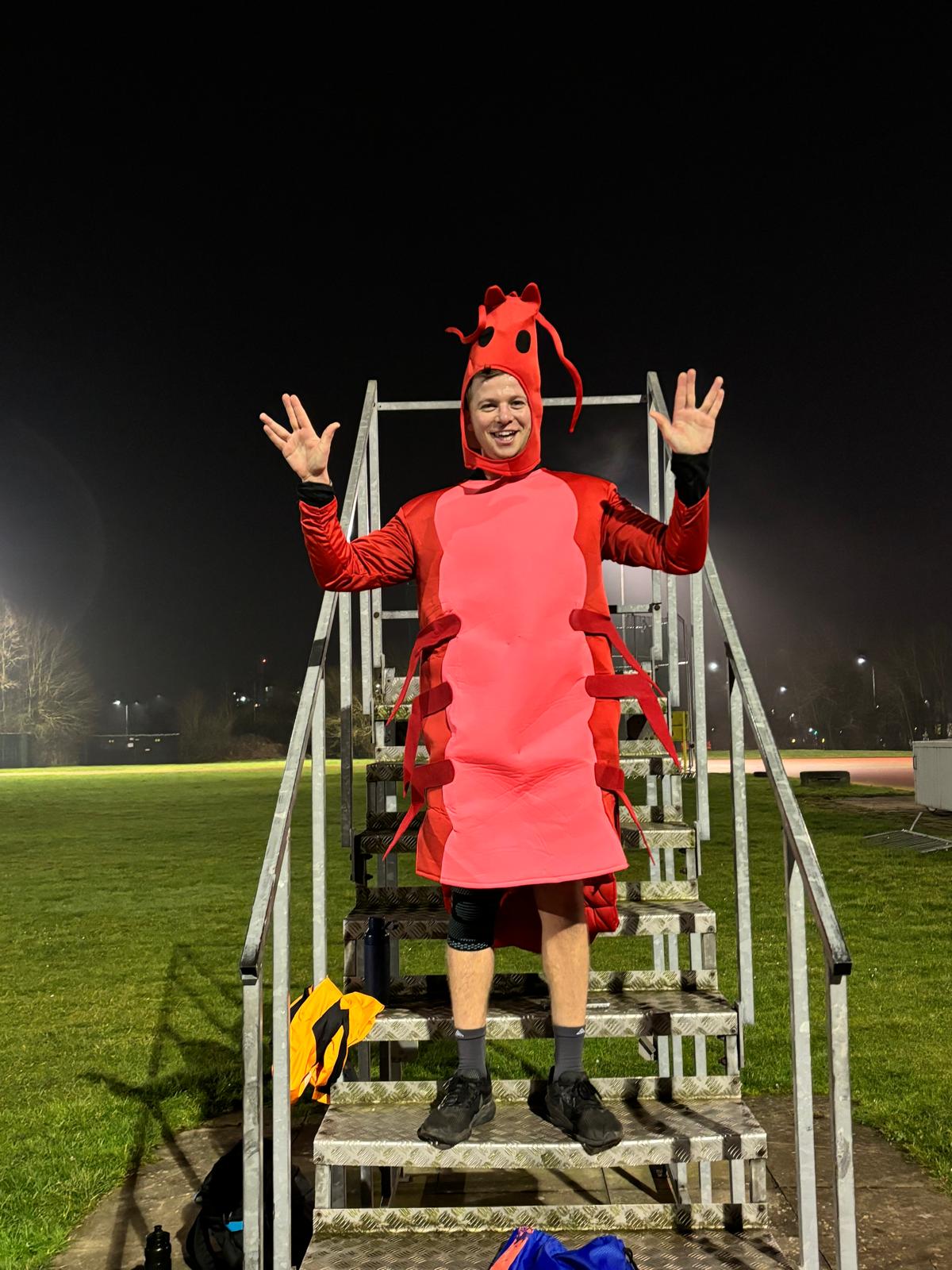 Man wearing a shrimp costume 