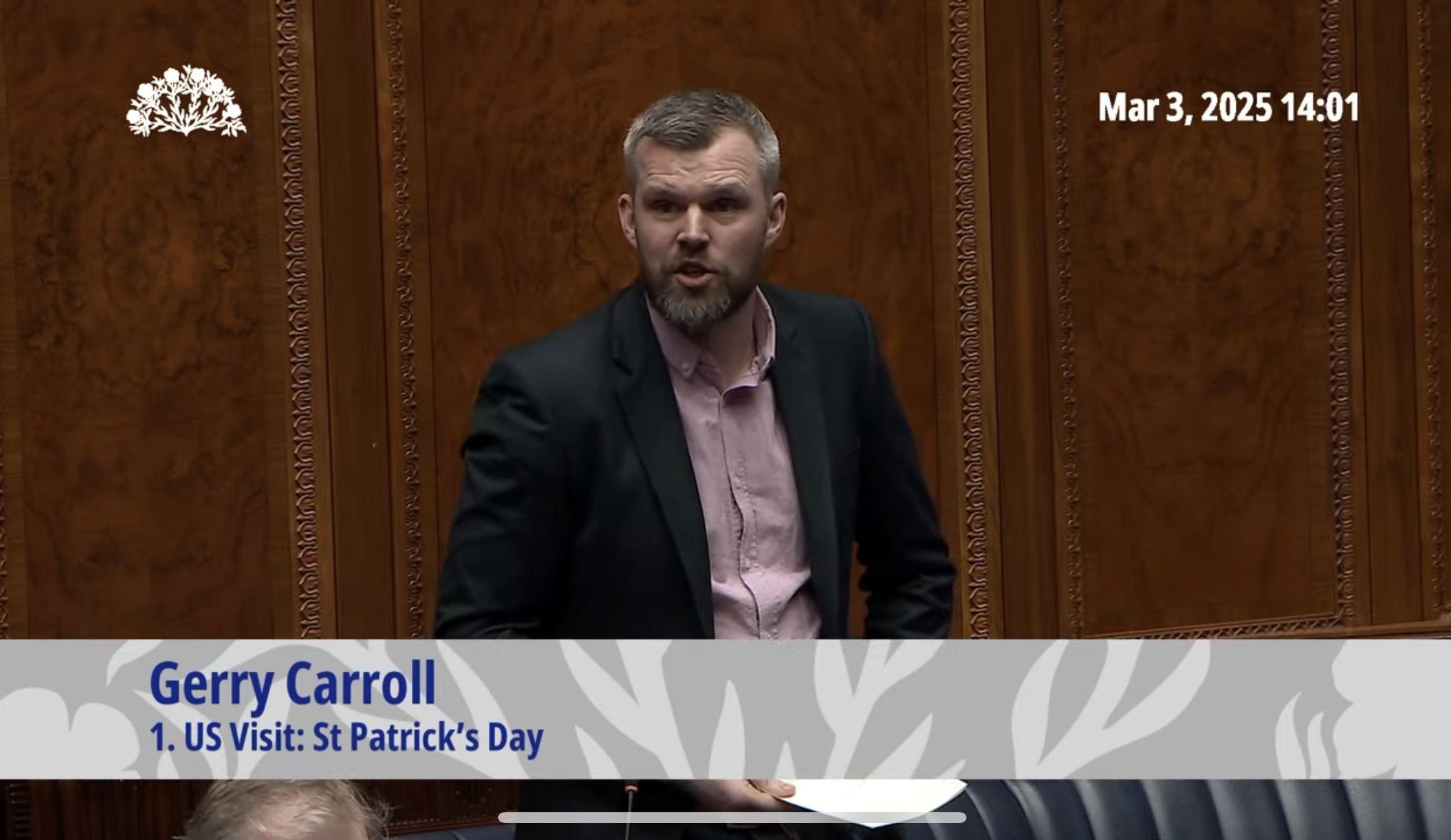 People Before Profit MLA Gerry Carroll questions First Minister Michelle O'Neill during questions for the Executive Office at the Northern Ireland Assembly on Monday