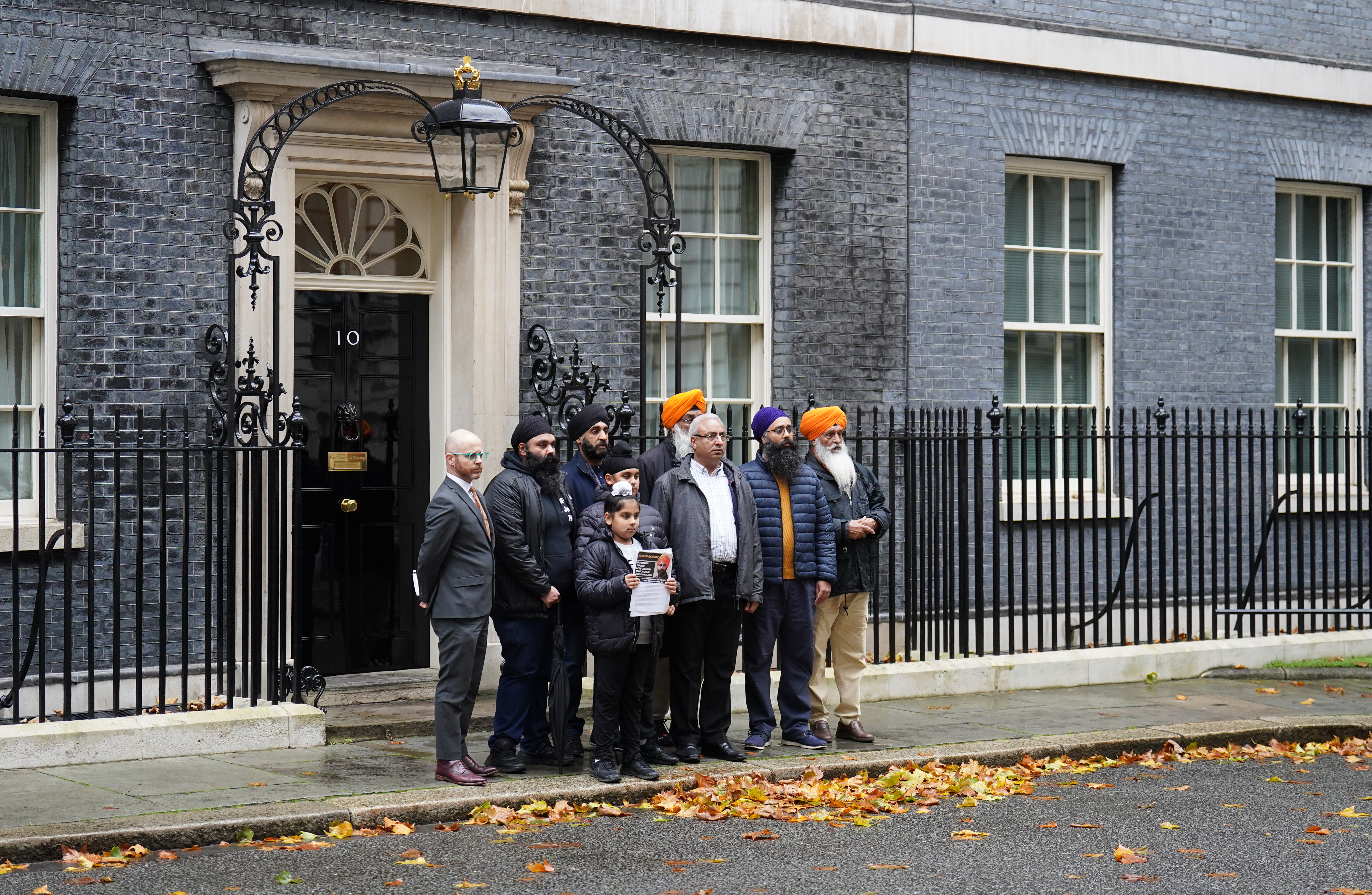 Group of people standing outside 10 Downing Street