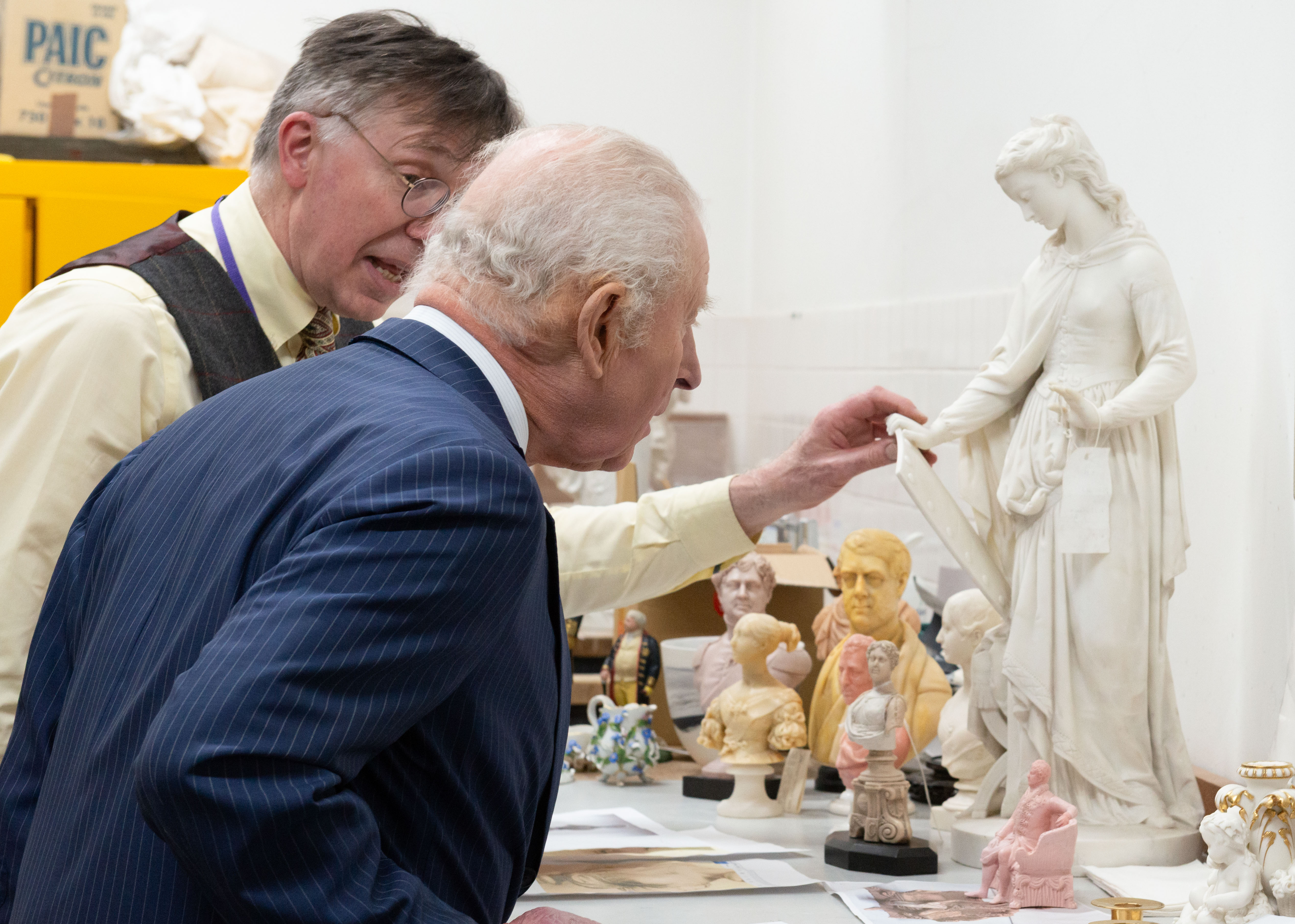 The King peers at a marble statuette by the sculptor Francis John Williamson 