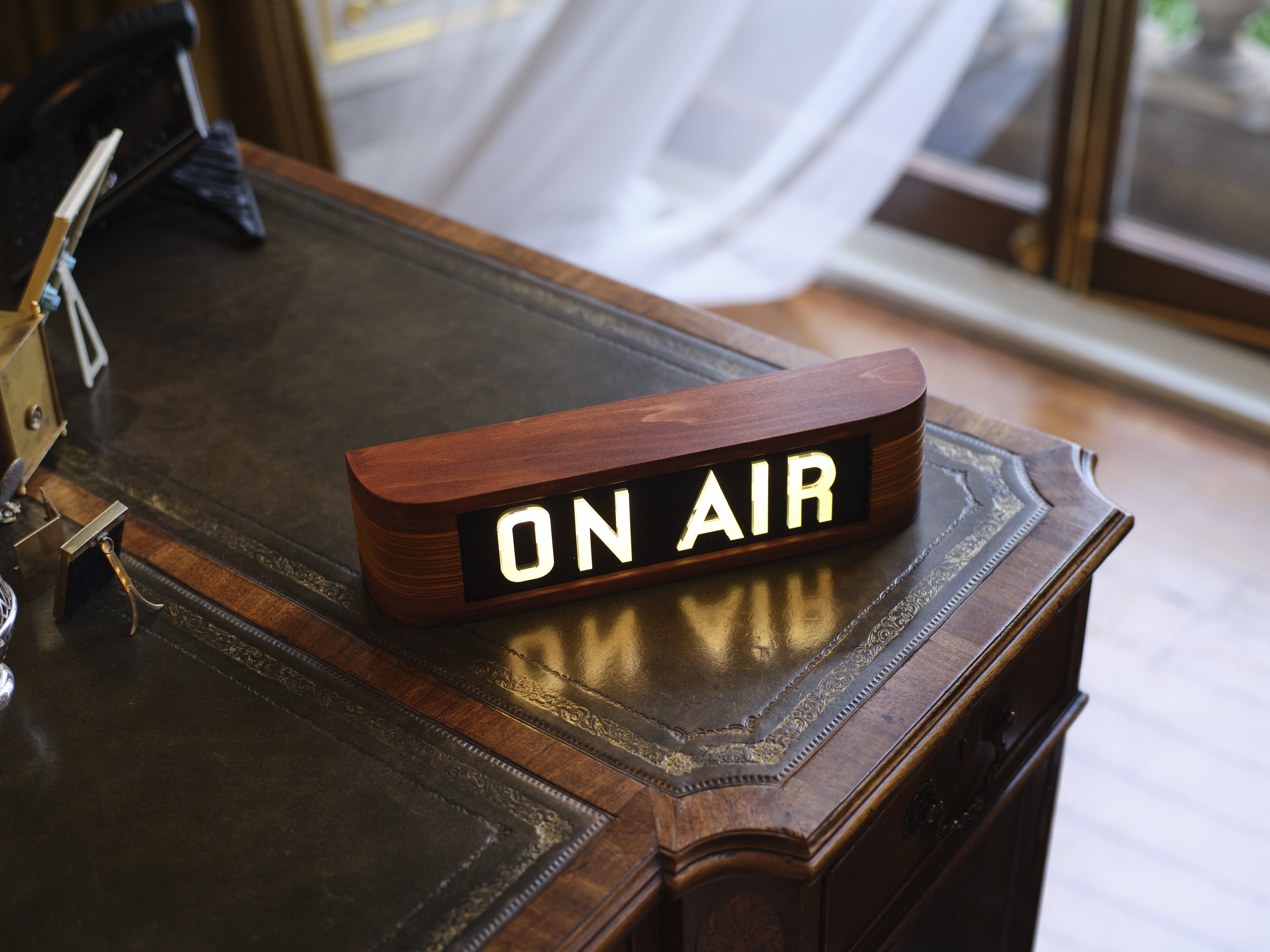 A close up of the "On Air" sign used by the King while recording the show 