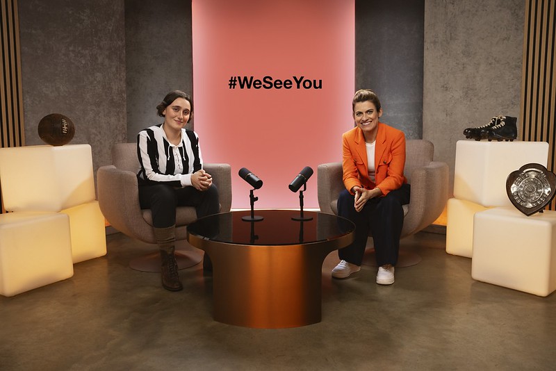 Karen Carney, right, sits alongside an AI recreation of former footballer Lily Parr created for Three's #WeSeeYou campaign