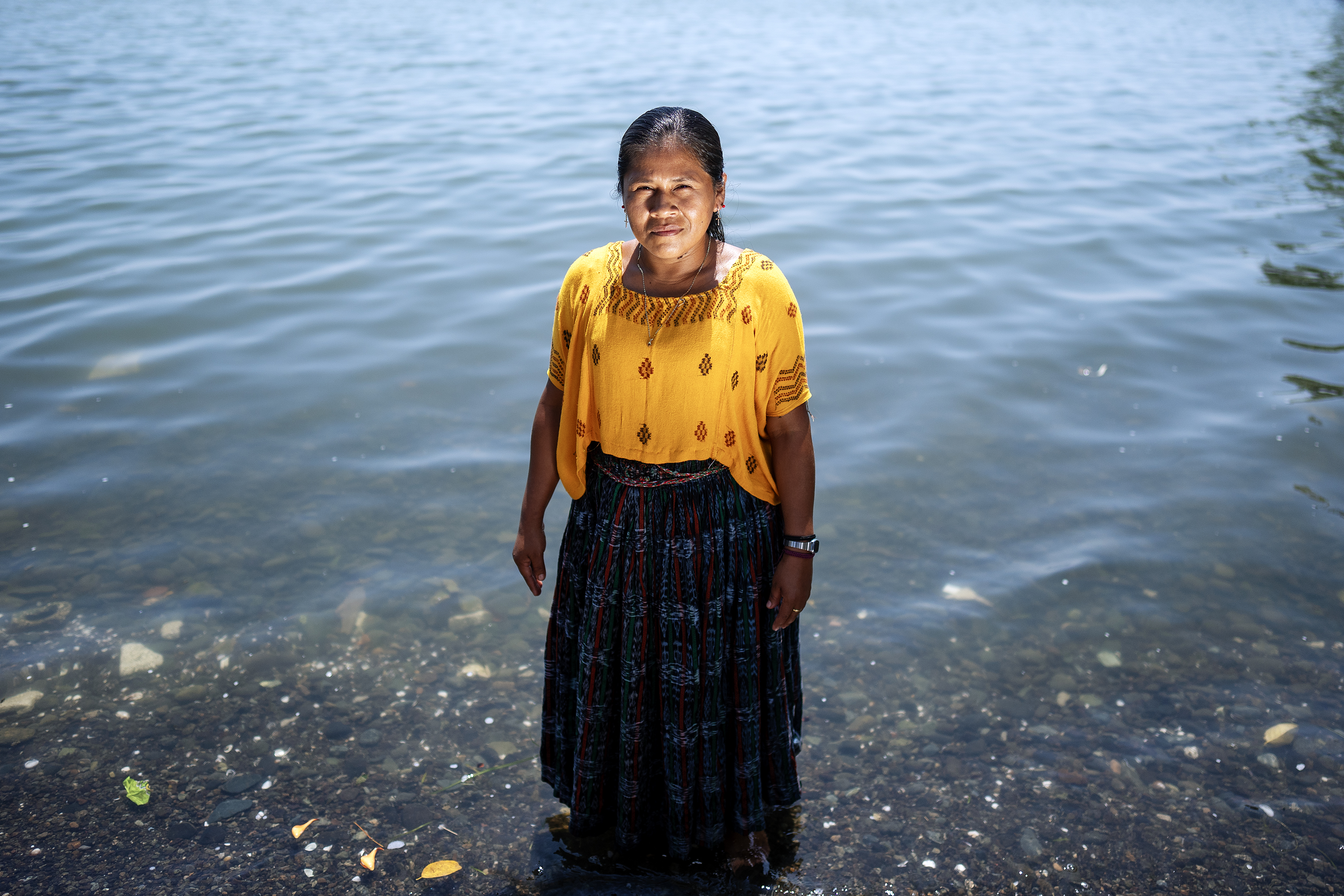 A woman stands in Lake Izabal in Guatemala