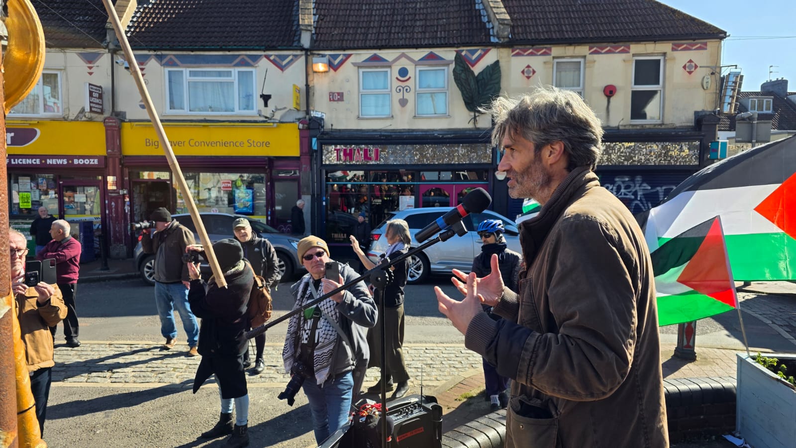 A man addressing a crowd