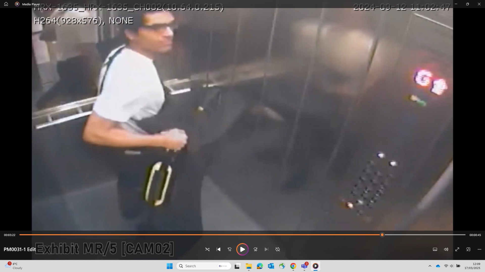 A CCTV still of Prosper with the gun in a large holdall in the lift going up to his family home