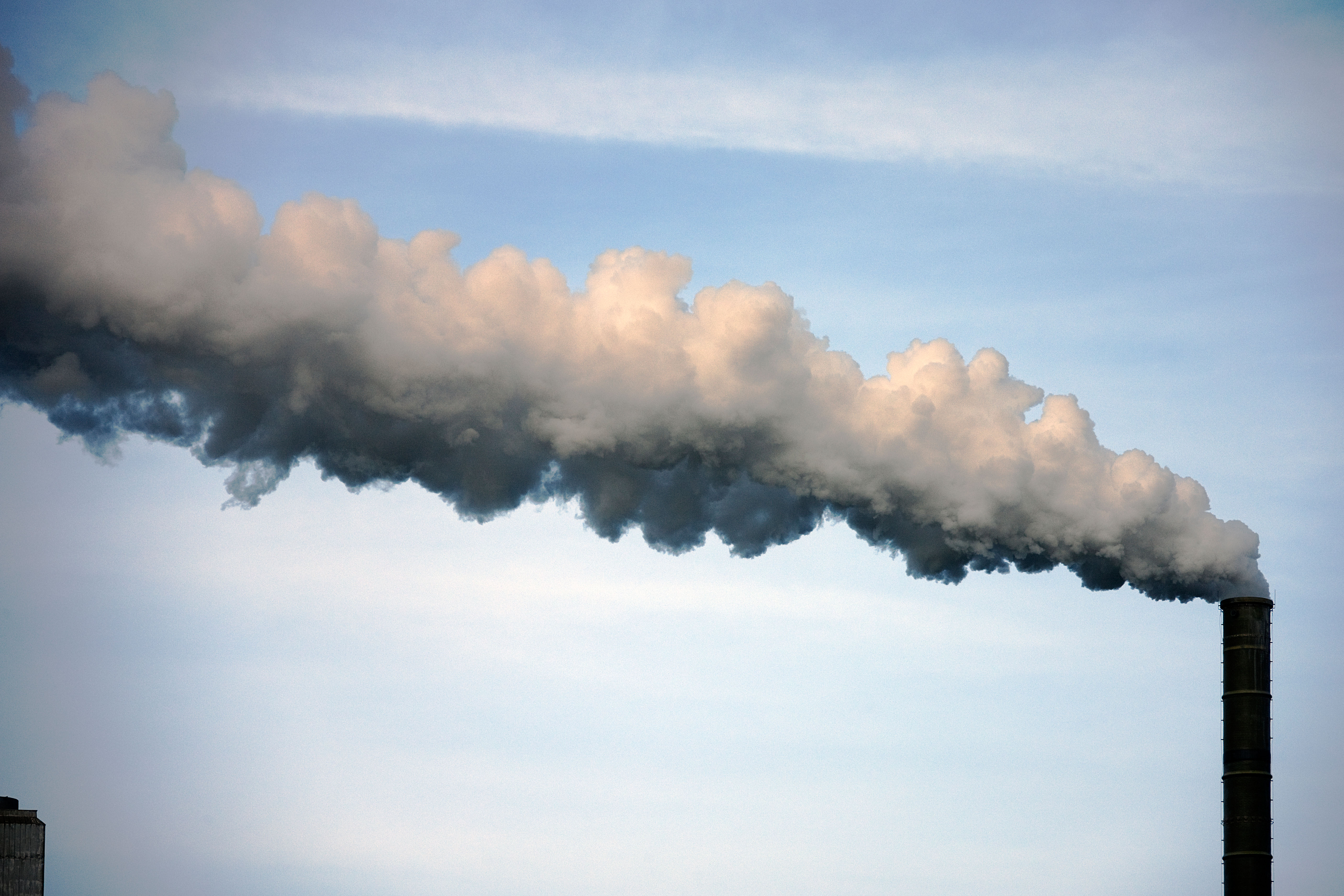 Fumes from an industrial chimney against the sky