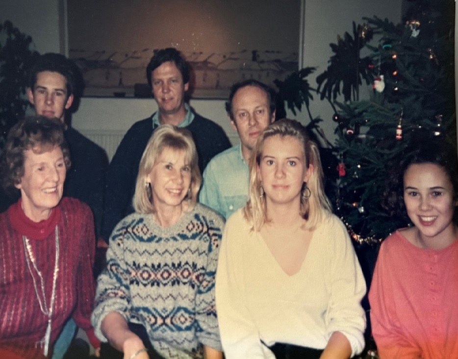 A family photo featuring Mrs Brown with her children, husband and extended family members