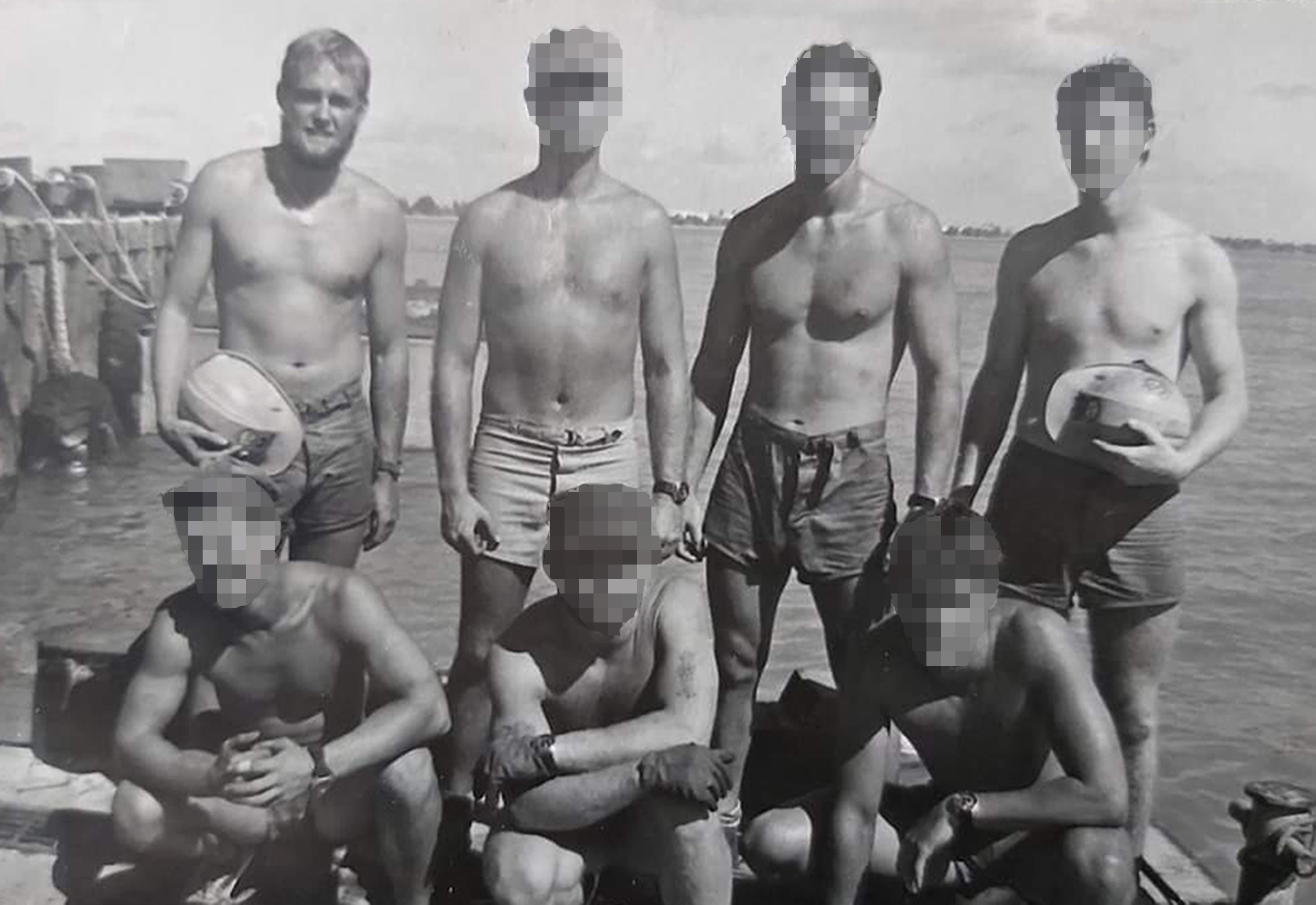 A black and white photo of Bob standing with other soldiers within the SAS, whose faces have been blurred 