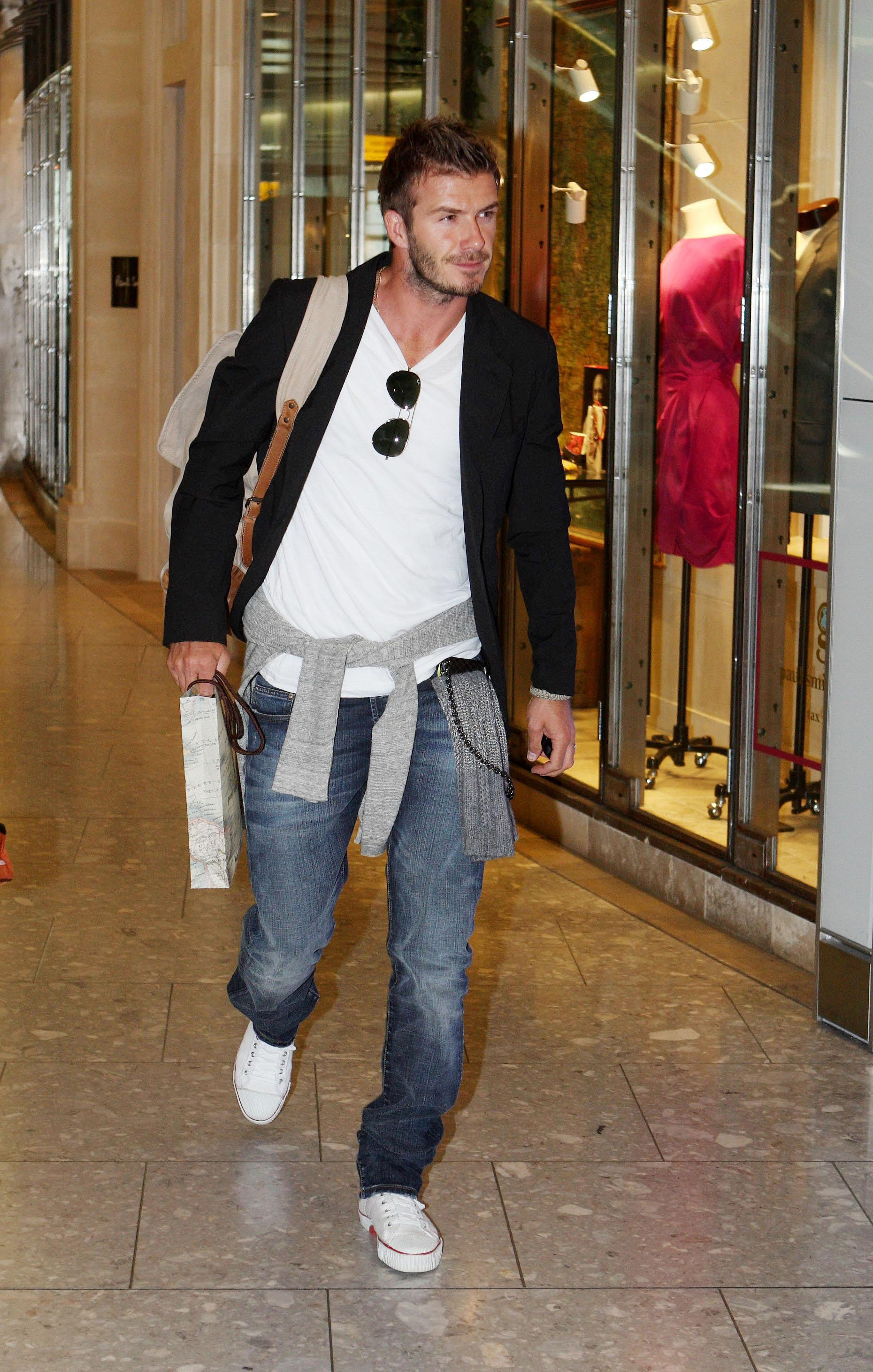David Beckham catches a British Airways flight from Terminal 5 of Heathrow Airport.