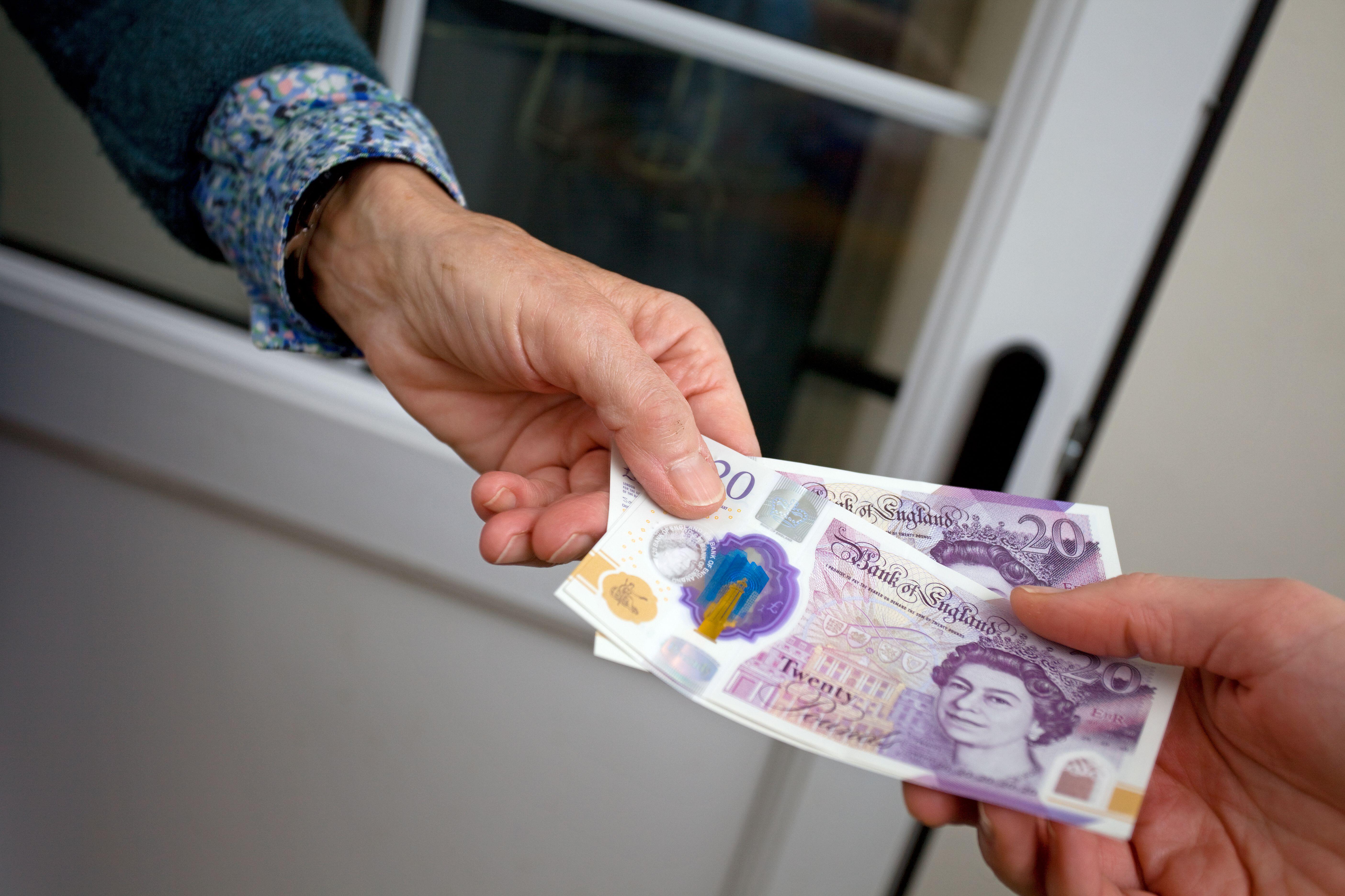 A person make a payment using bank notes 