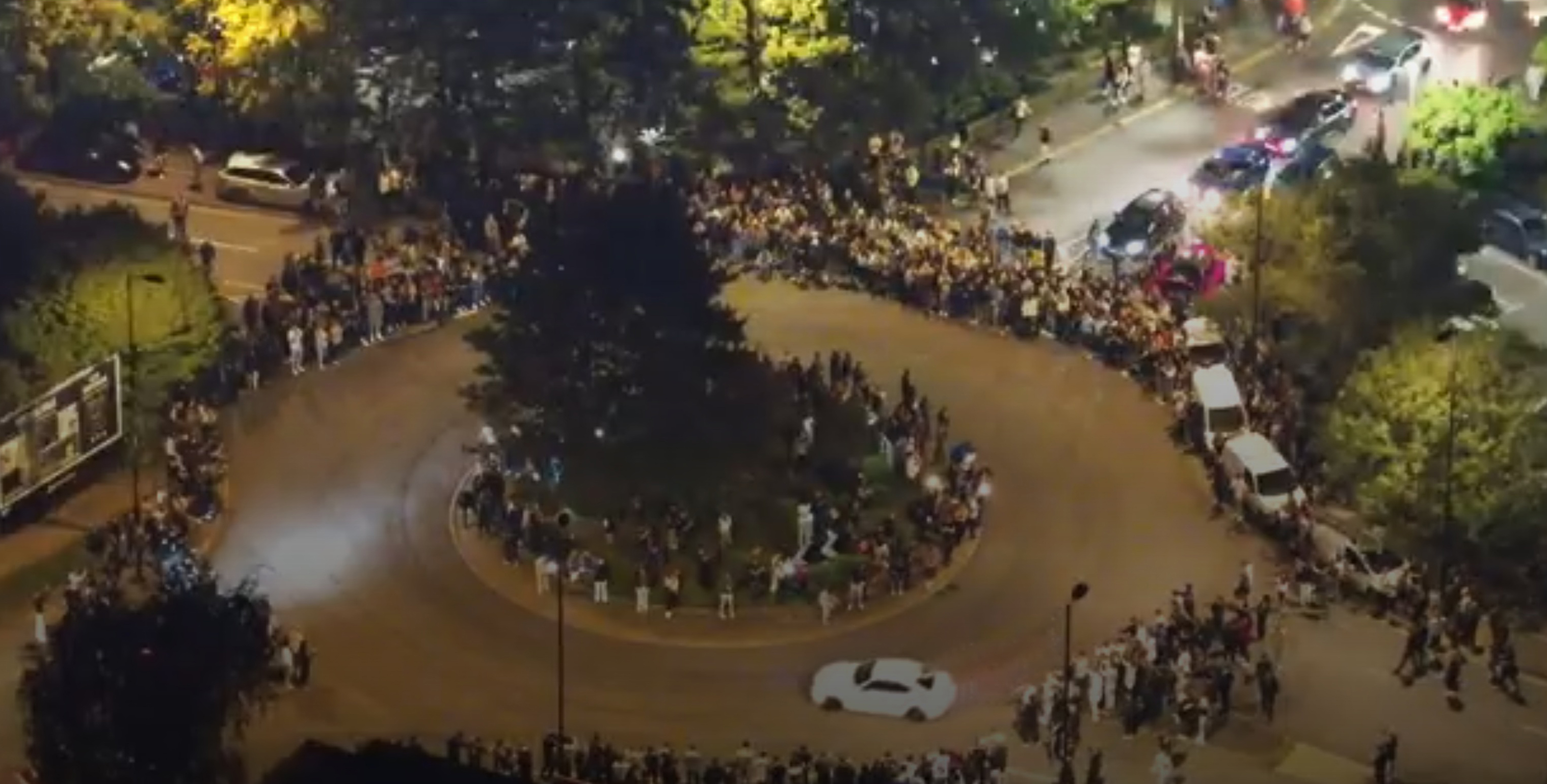 Toby Clarkson's white BMW being driven dangerously at a car meet in Southampton
