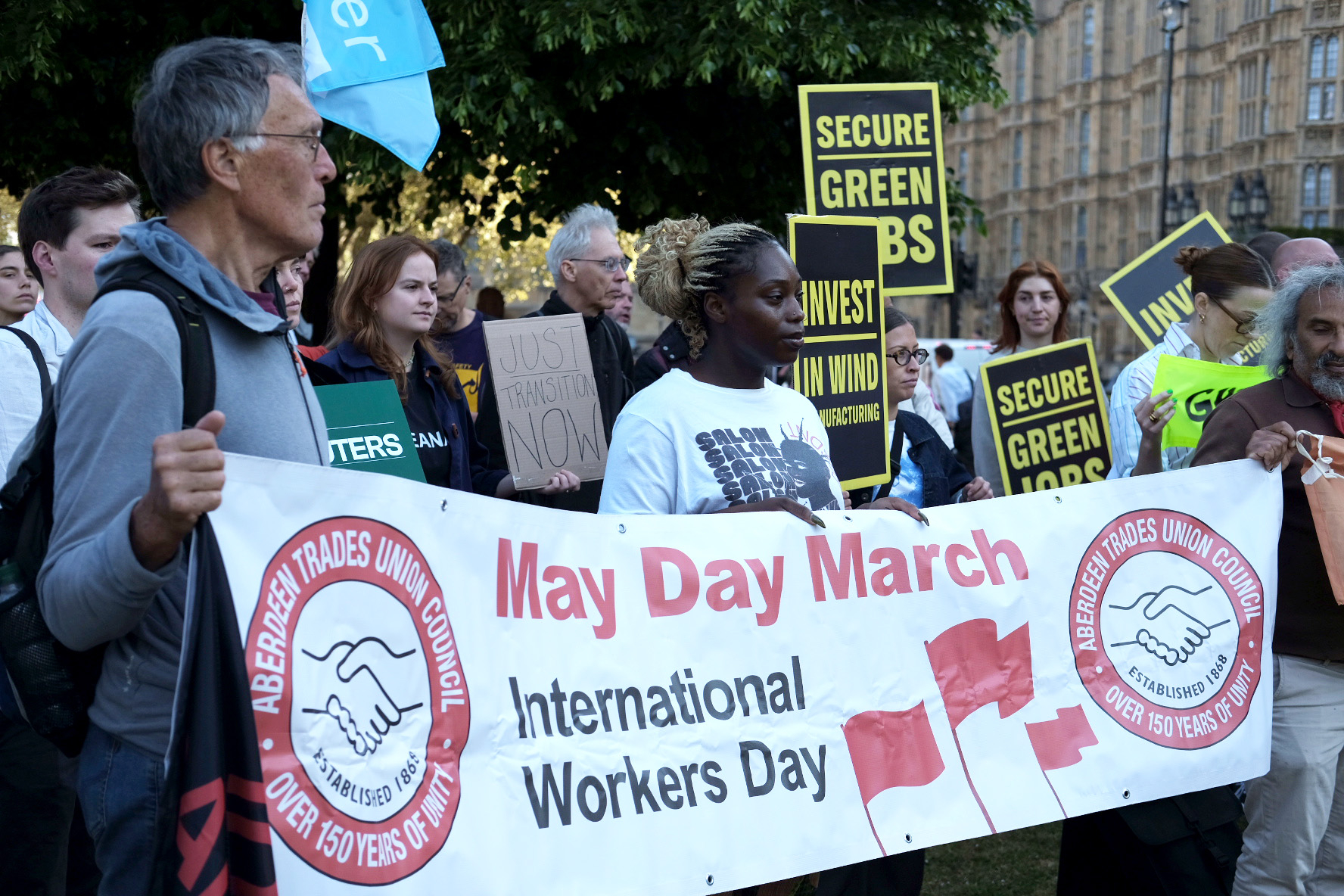 Climate activists and trade unionists protesting outside Parliament