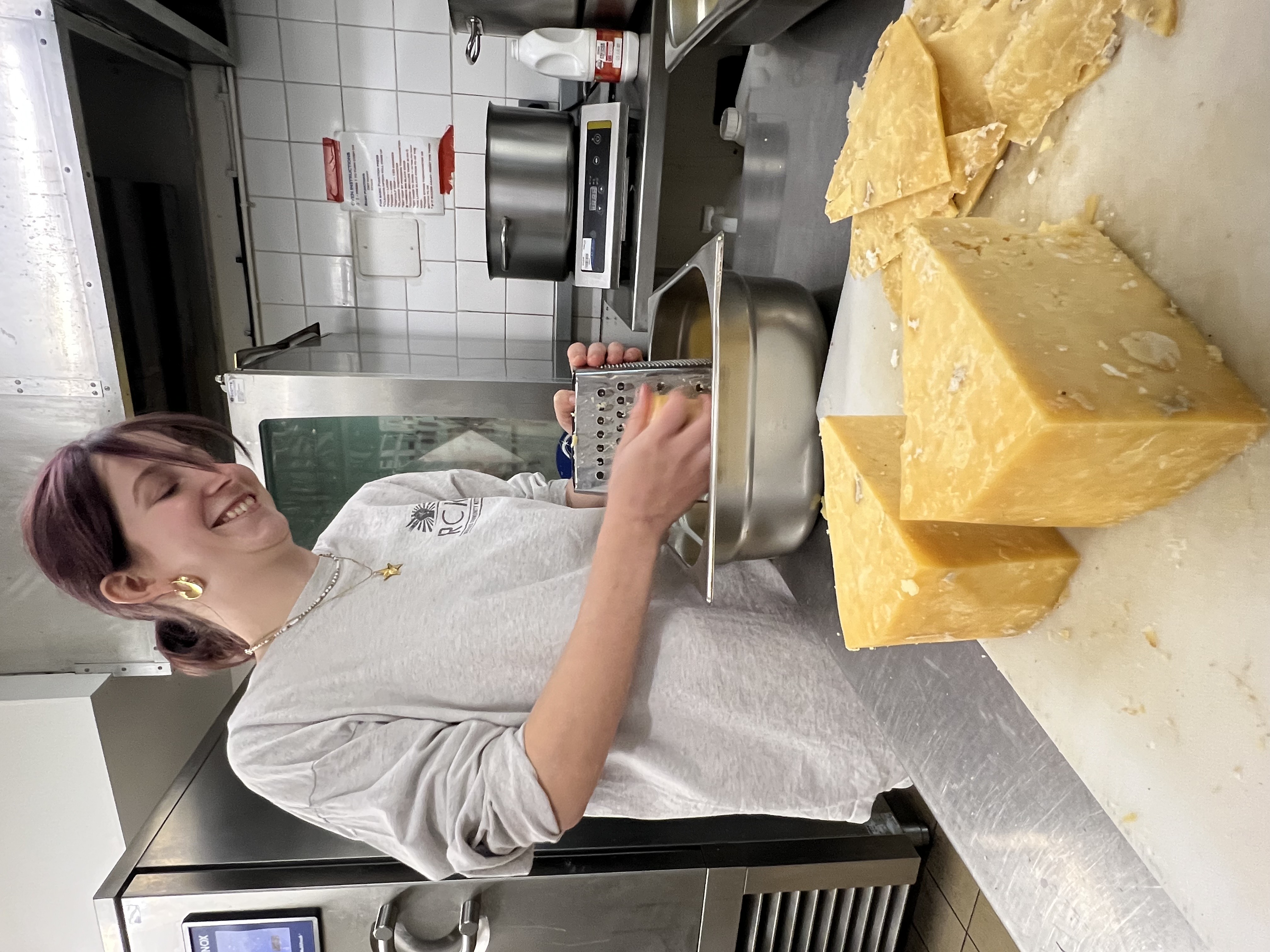 A woman preparing cheese