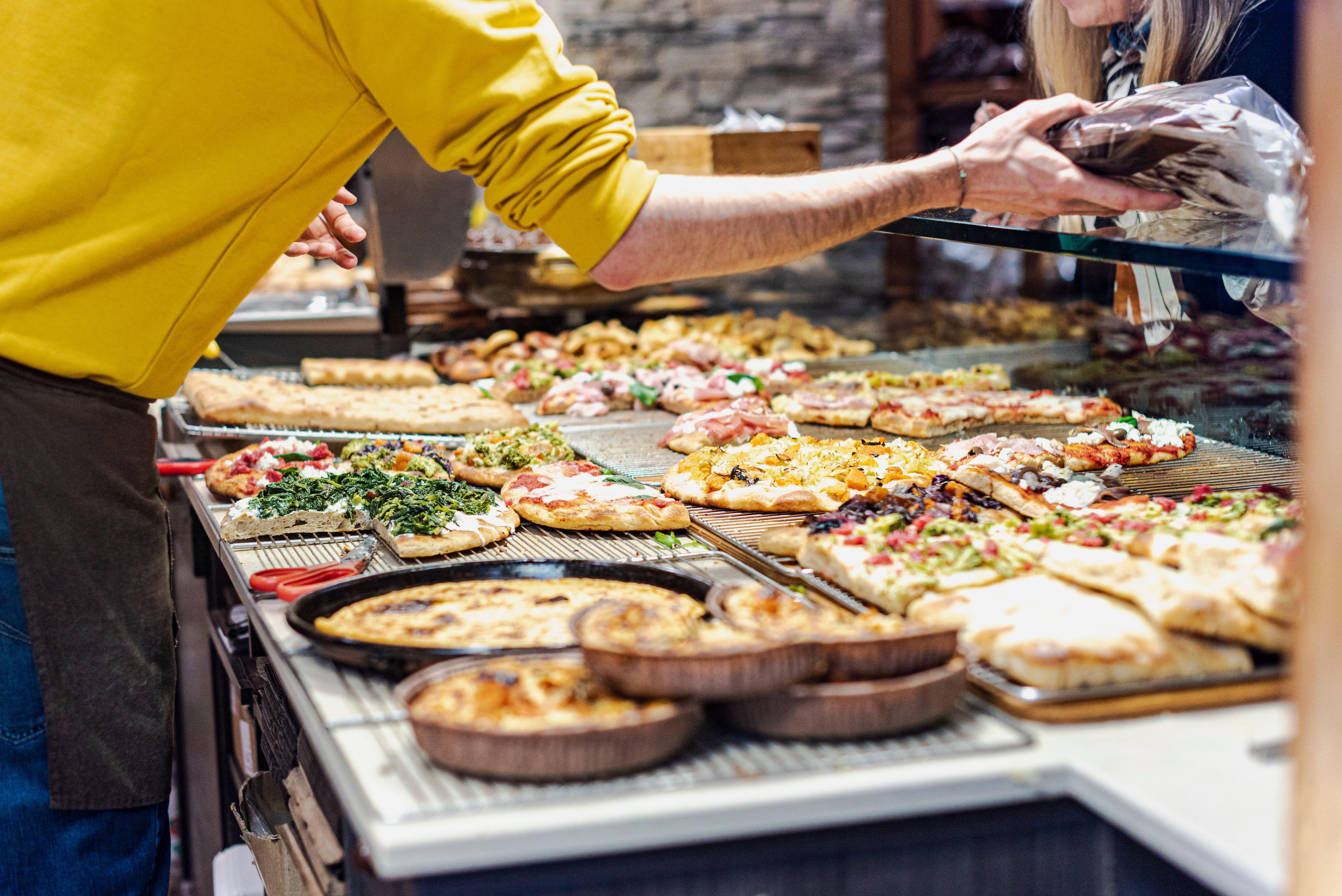 Someone making pizza